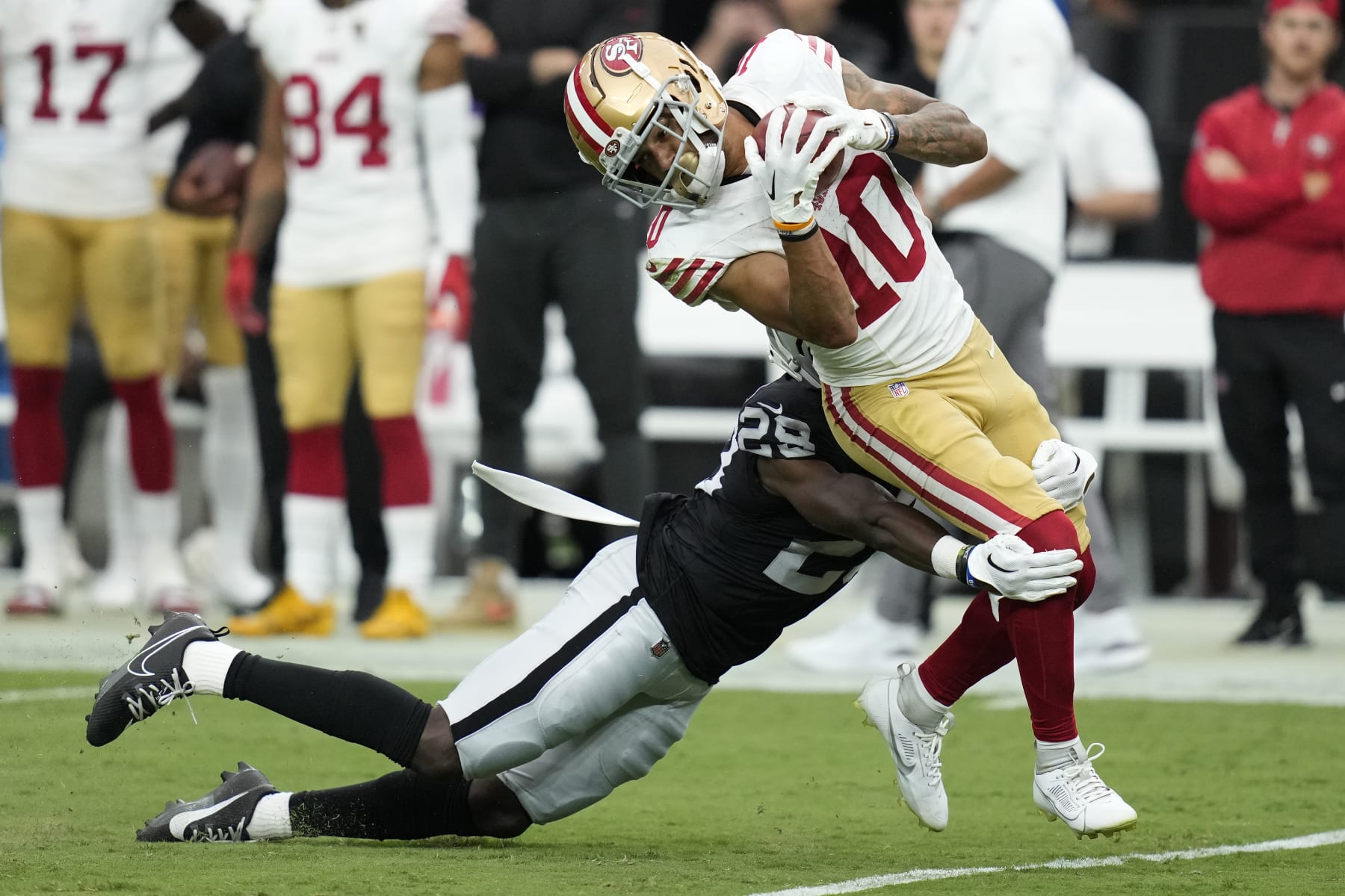 Las Vegas Raiders cornerback Jakorian Bennett tackles San Francisco 49ers wide receiver Ronnie Bell (10) during the first half of an NFL preseason football game, Sunday, Aug. 13, 2023, in Las Vegas. (AP Photo/John Locher)
