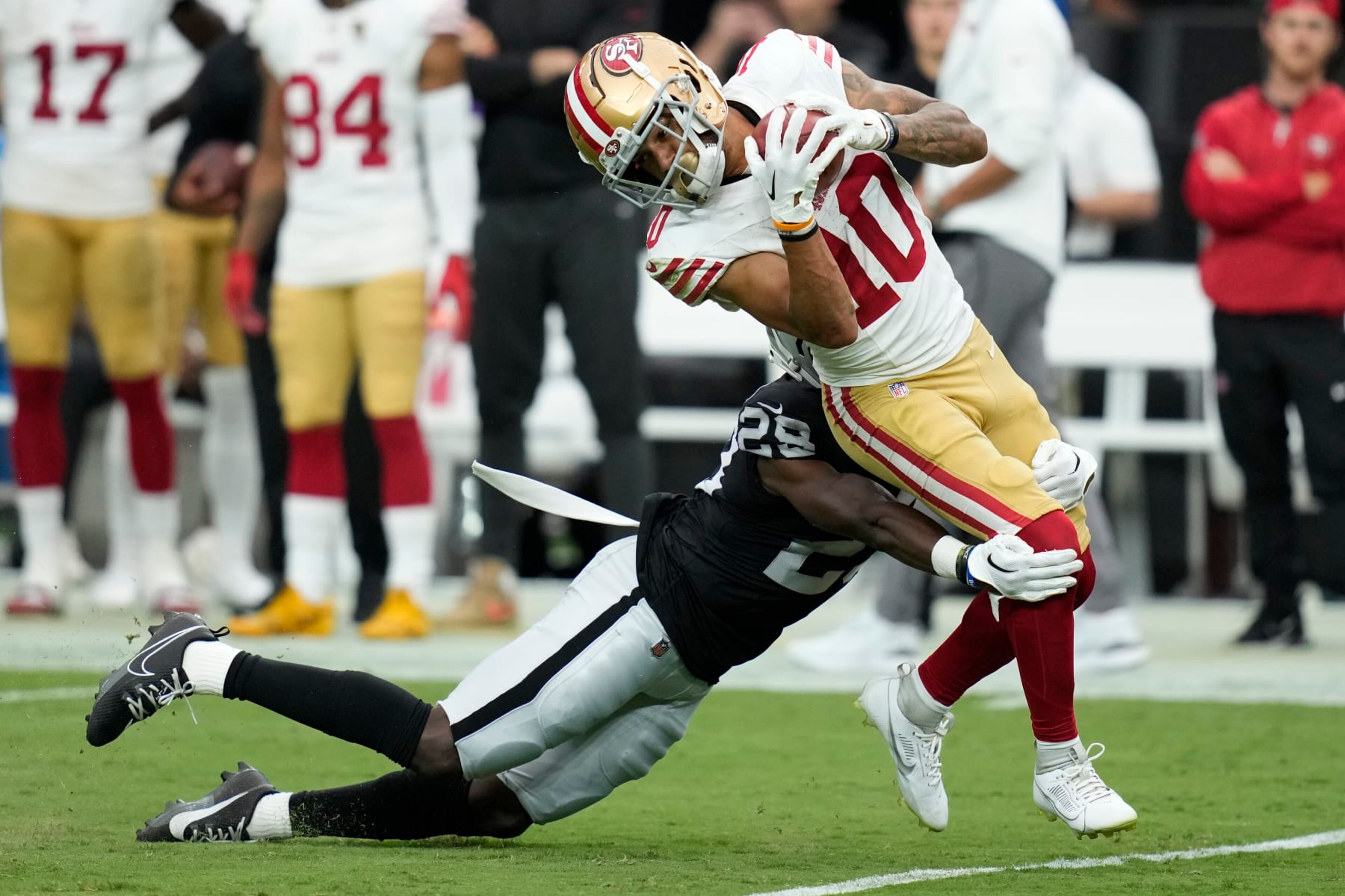 Las Vegas Raiders cornerback Jakorian Bennett tackles San Francisco 49ers wide receiver Ronnie Bell (10) during the first half of an NFL preseason football game, Sunday, Aug. 13, 2023, in Las Vegas. (AP Photo/John Locher)