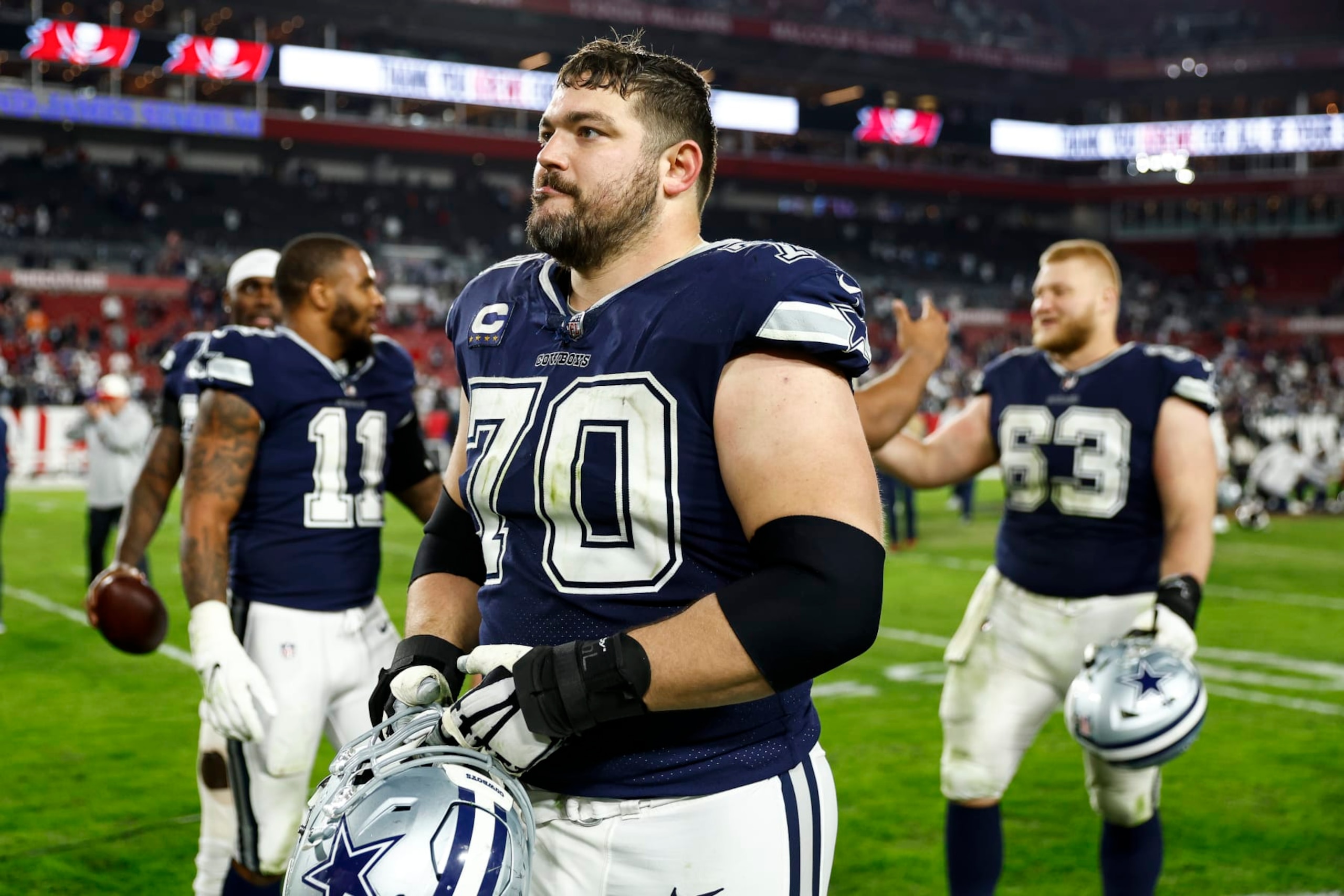 TAMPA, FL - JANUARY 16: Zack Martin #70 of the Dallas Cowboys walks off the field after an NFL wild card playoff football game against the Tampa Bay Buccaneers at Raymond James Stadium on January 16, 2023 in Tampa, Florida. (Photo by Kevin Sabitus/Getty Images)