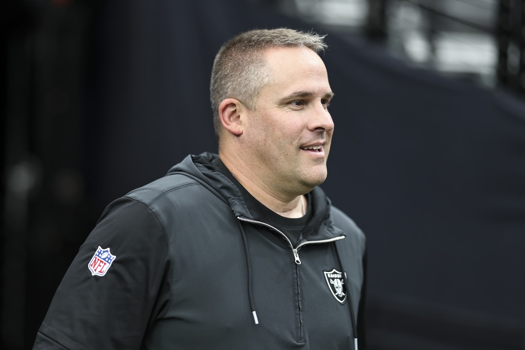 LAS VEGAS, NEVADA - AUGUST 13: Head coach Josh McDaniels of the Las Vegas Raiders reacts as he takes the field prior to a preseason game between the San Francisco 49ers and the Las Vegas Raiders at Allegiant Stadium on August 13, 2023 in Las Vegas, Nevada. (Photo by Michael Owens/Getty Images)