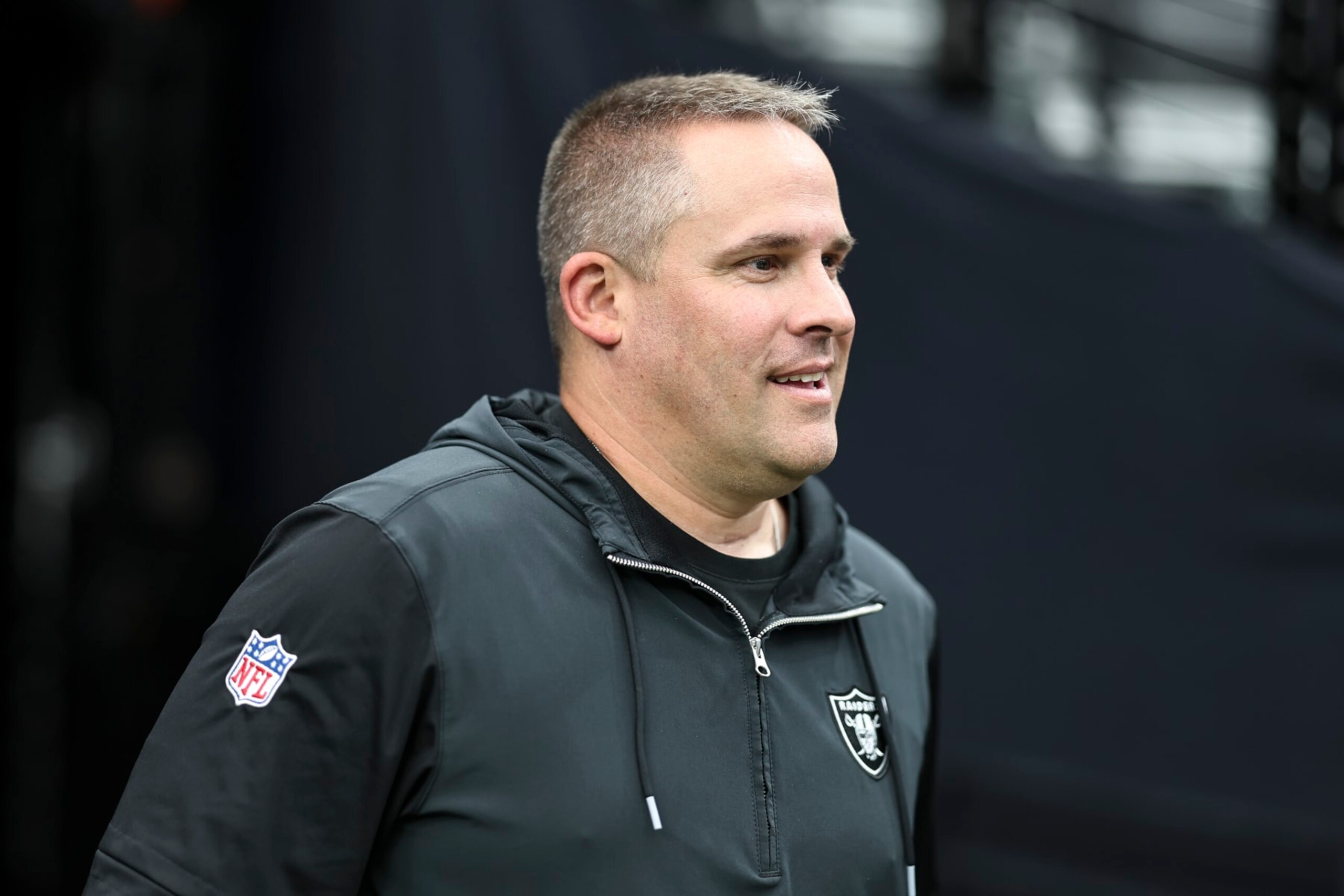LAS VEGAS, NEVADA - AUGUST 13: Head coach Josh McDaniels of the Las Vegas Raiders reacts as he takes the field prior to a preseason game between the San Francisco 49ers and the Las Vegas Raiders at Allegiant Stadium on August 13, 2023 in Las Vegas, Nevada. (Photo by Michael Owens/Getty Images)