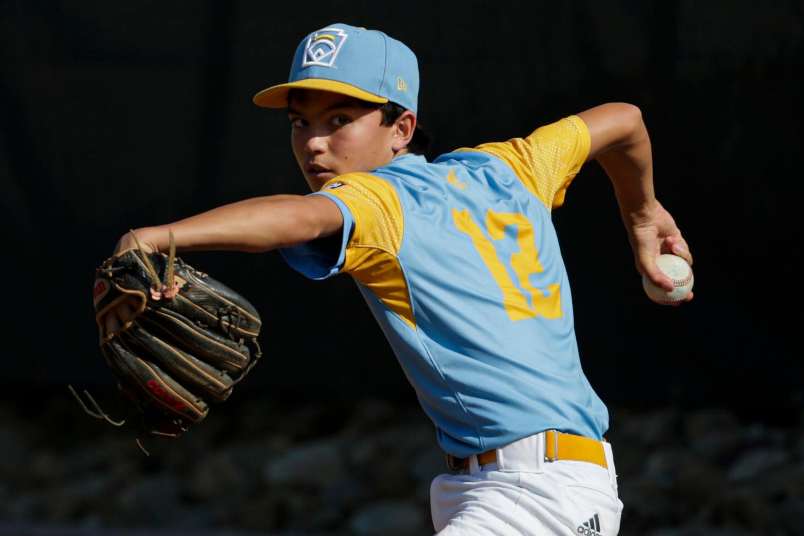 SOUTH WILLIAMSPORT, PENNSYLVANIA - AUGUST 28: Daly Watson #12 of the West Region team from Honolulu, Hawaii warms up in the bullpen during the third inning of the Little League World Series Championship game against the Caribbean Region team from Willemstad, Curacao at the Little League International Complex on August 28, 2022 in South Williamsport, Pennsylvania. (Photo by Joshua Bessex/Getty Images) SOUTH WILLIAMSPORT, PENNSYLVANIA - AUGUST 28: Daly Watson #12 of the West Region team from Honolulu, Hawaii warms up in the bullpen during the third inning of the Little League World Series Championship game against the Caribbean Region team from Willemstad, Curacao at the Little League International Complex on August 28, 2022 in South Williamsport, Pennsylvania. (Photo by Joshua Bessex/Getty Images)