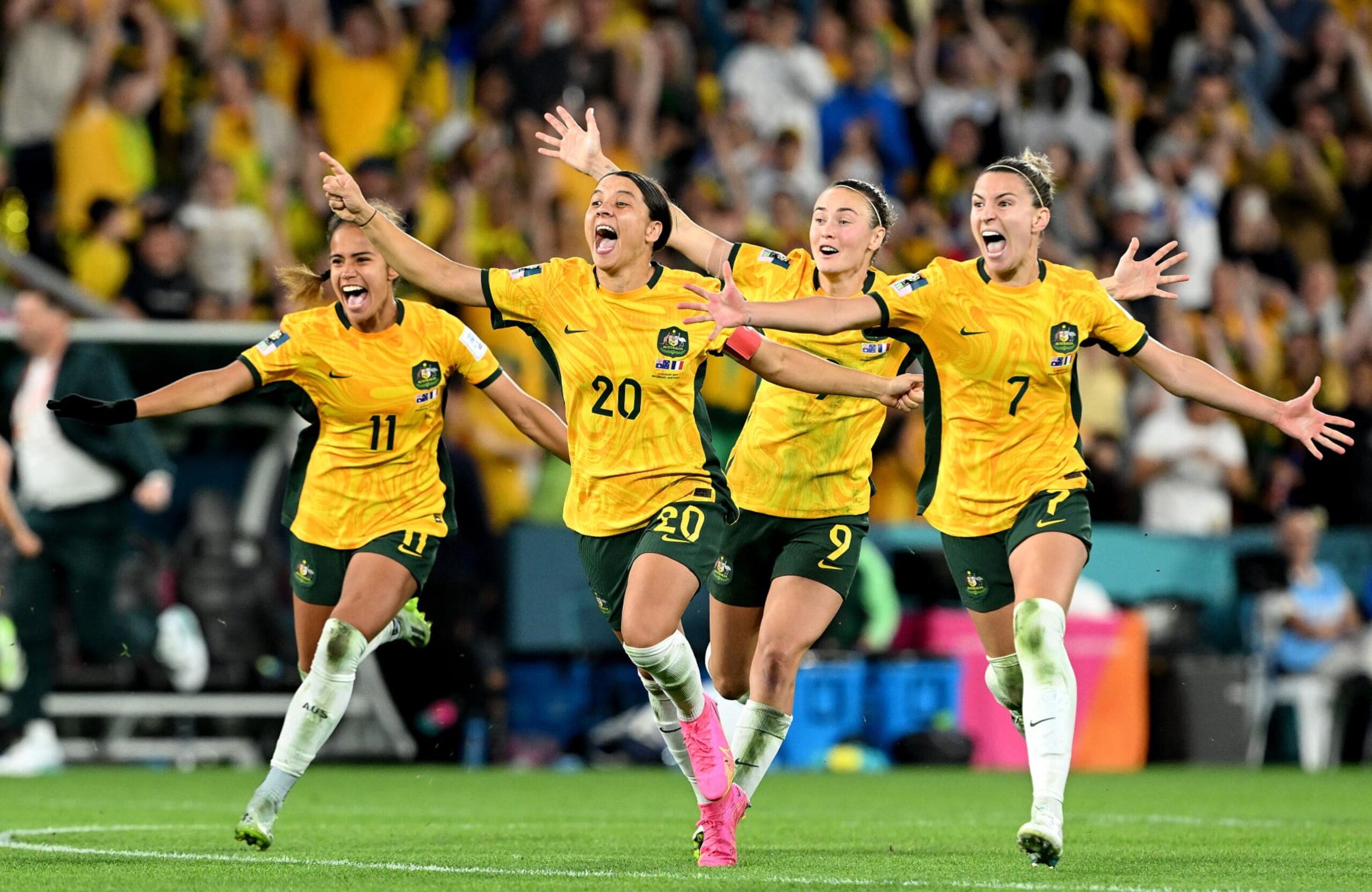 BRISBANE, AUSTRALIA - AUGUST 12: (L-R) Mary Fowler, Sam Kerr, Caitlin Foord and Steph Catley of Australia celebrate the team’s victory through the penalty shoot out following the FIFA Women's World Cup Australia & New Zealand 2023 Quarter Final match between Australia and France at Brisbane Stadium on August 12, 2023 in Brisbane, Australia. (Photo by Bradley Kanaris/Getty Images)
