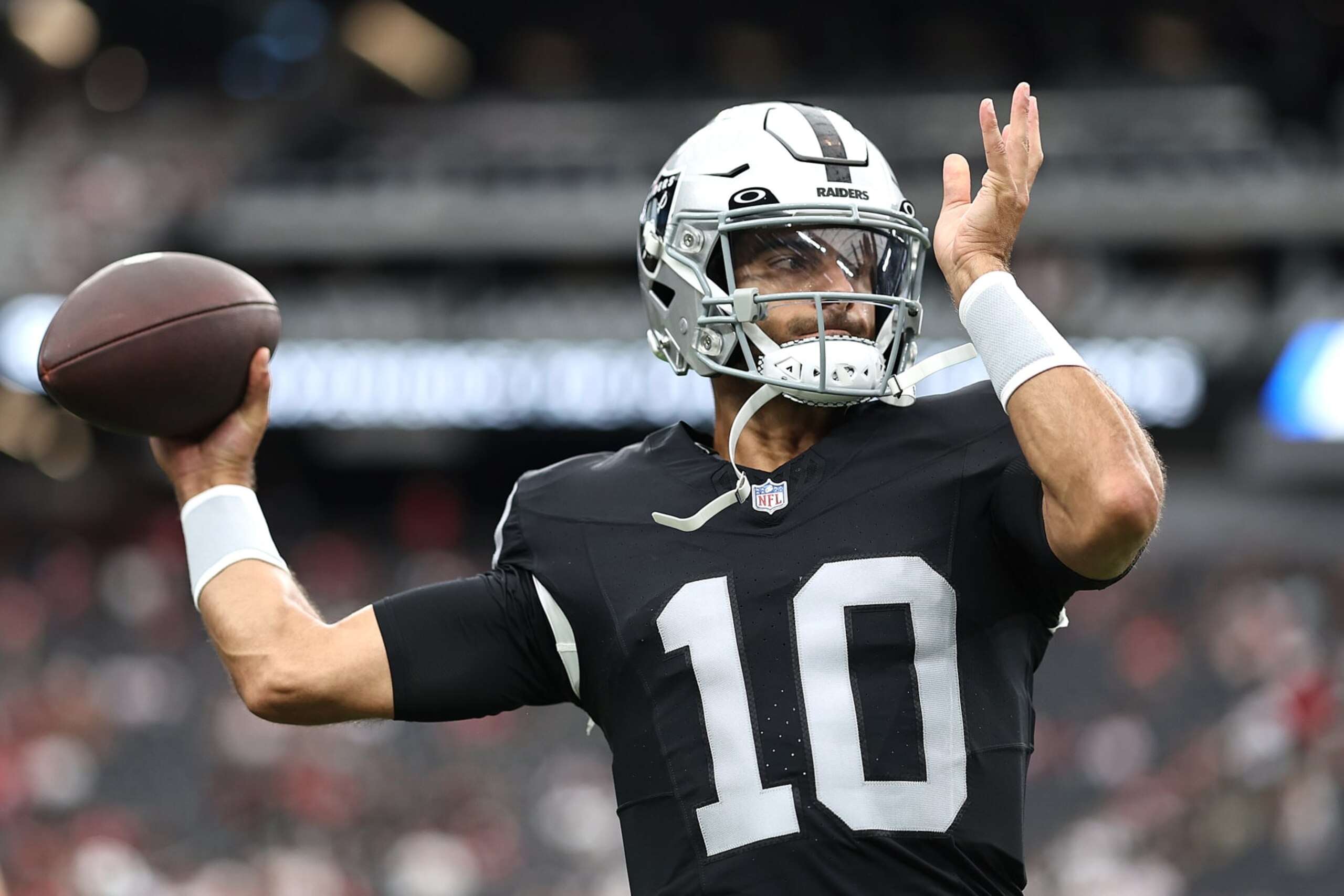 LAS VEGAS, NEVADA - AUGUST 13: Jimmy Garoppolo #10 of the Las Vegas Raiders warms up prior to a preseason game against the San Francisco 49ers at Allegiant Stadium on August 13, 2023 in Las Vegas, Nevada. (Photo by Michael Owens/Getty Images)