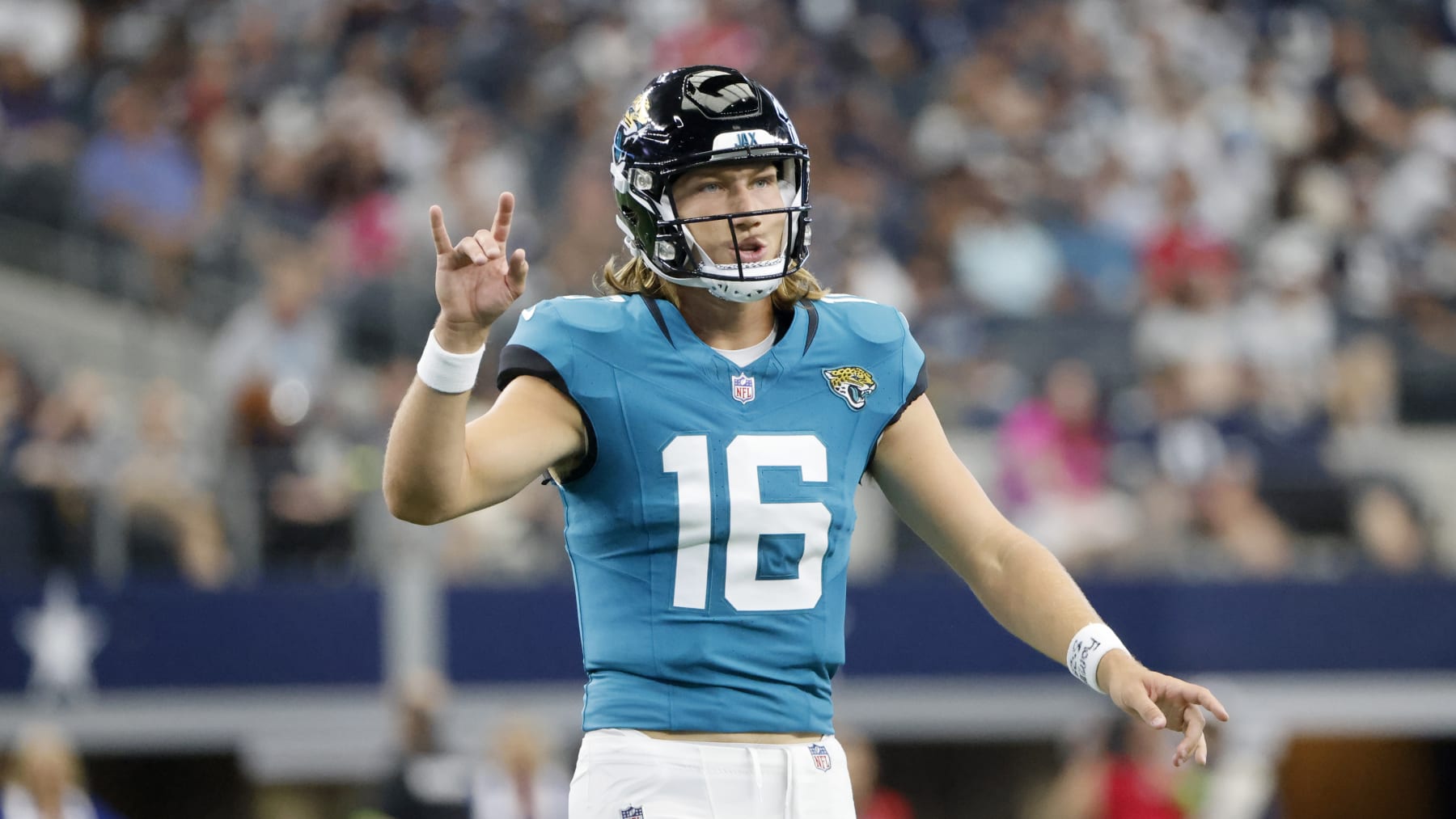 Jacksonville Jaguars quarterback Trevor Lawrence (16) signals for a play during an NFL Football game in Arlington, Texas, Saturday, August 12, 2023. (AP Photo/Michael Ainsworth)