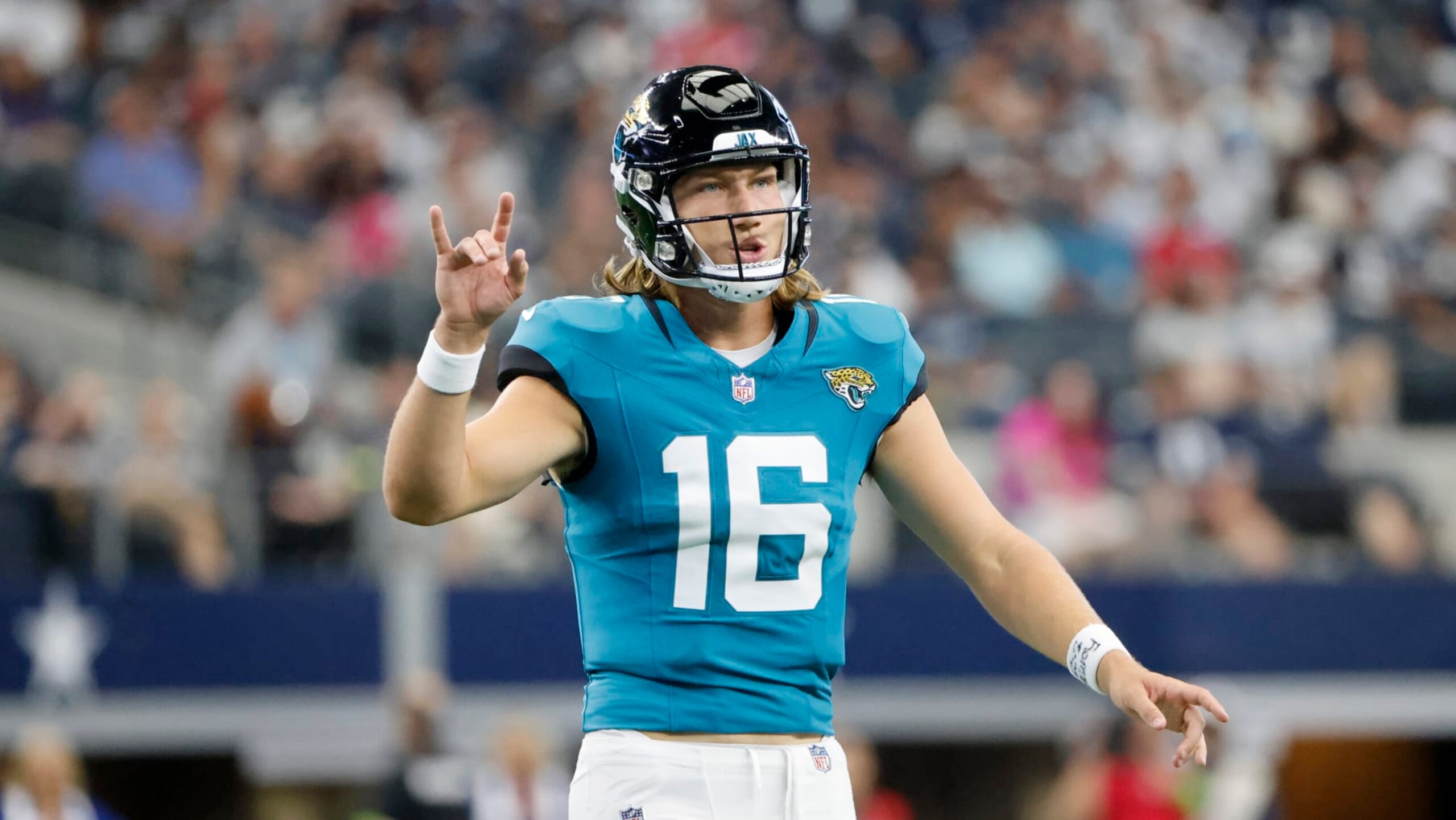 Jacksonville Jaguars quarterback Trevor Lawrence (16) signals for a play during an NFL Football game in Arlington, Texas, Saturday, August 12, 2023. (AP Photo/Michael Ainsworth)