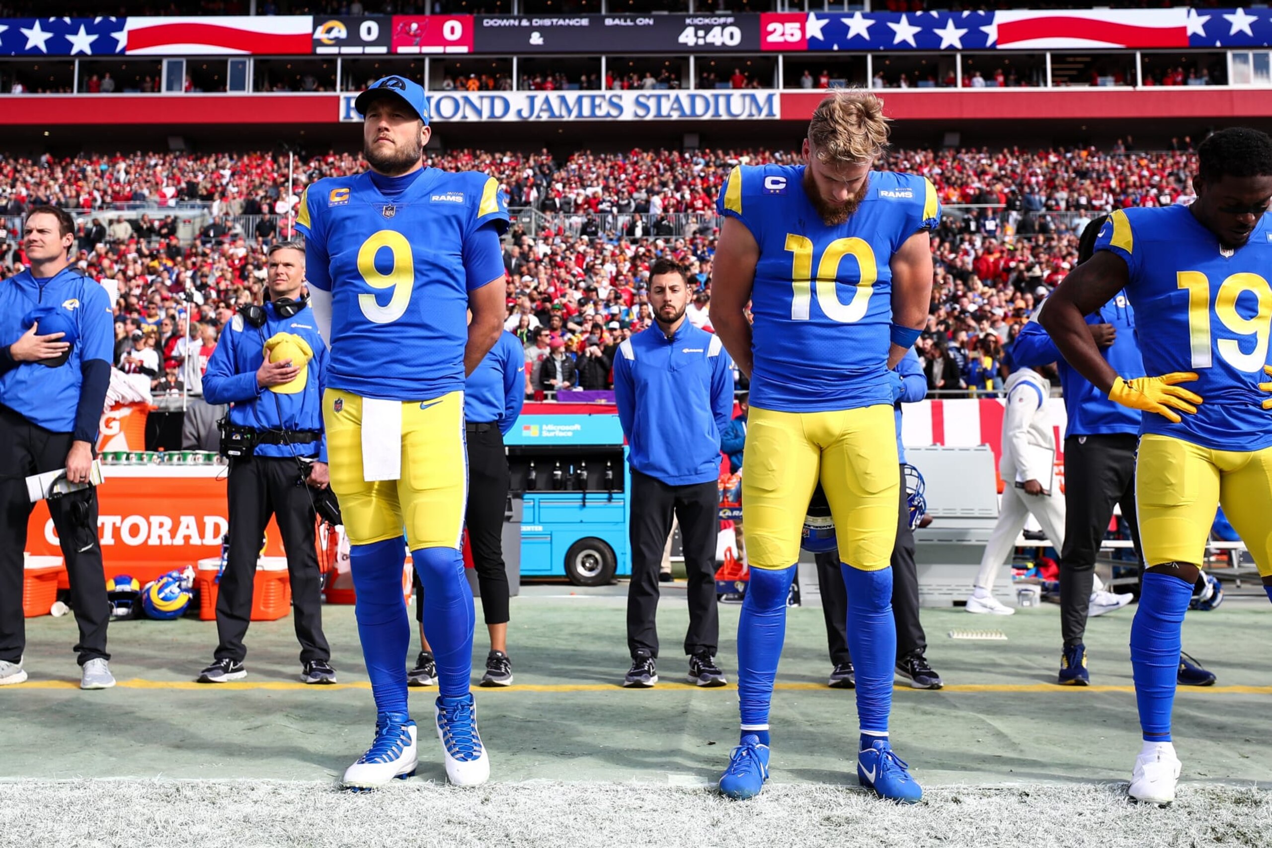 TAMPA, FL - JANUARY 23: Matthew Stafford #9 and Cooper Kupp #10 of the Los Angeles Rams stand during the national anthem prior to the NFC Divisional Playoff game against the Tampa Bay Buccaneers at Raymond James Stadium on January 23, 2022 in Tampa, Florida. (Photo by Kevin Sabitus/Getty Images)