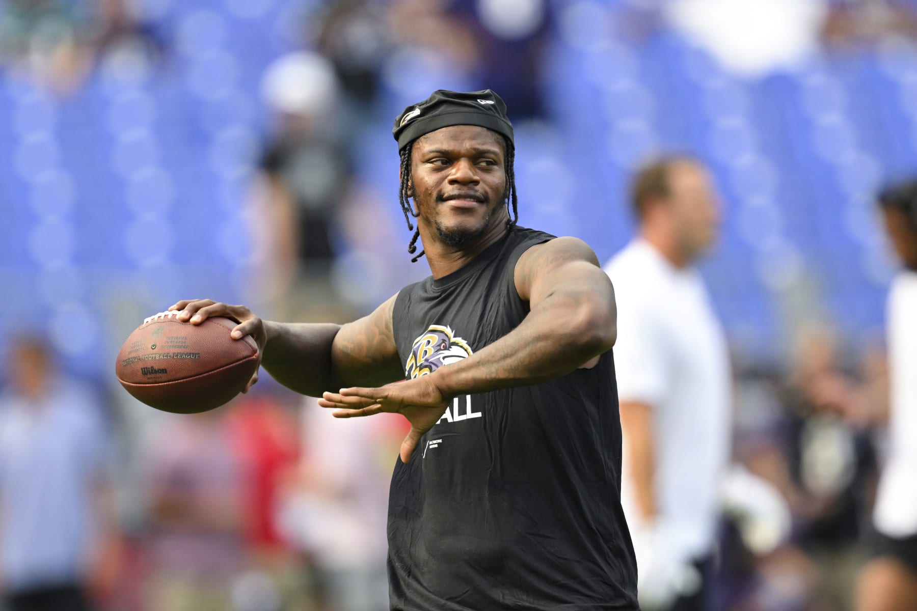 Baltimore Ravens quarterback Lamar Jackson throws during pre-game warm-ups before an NFL preseason football game against the Philadelphia Eagles, Saturday, Aug. 12, 2022, in Baltimore. (AP Photo/Terrance Williams)