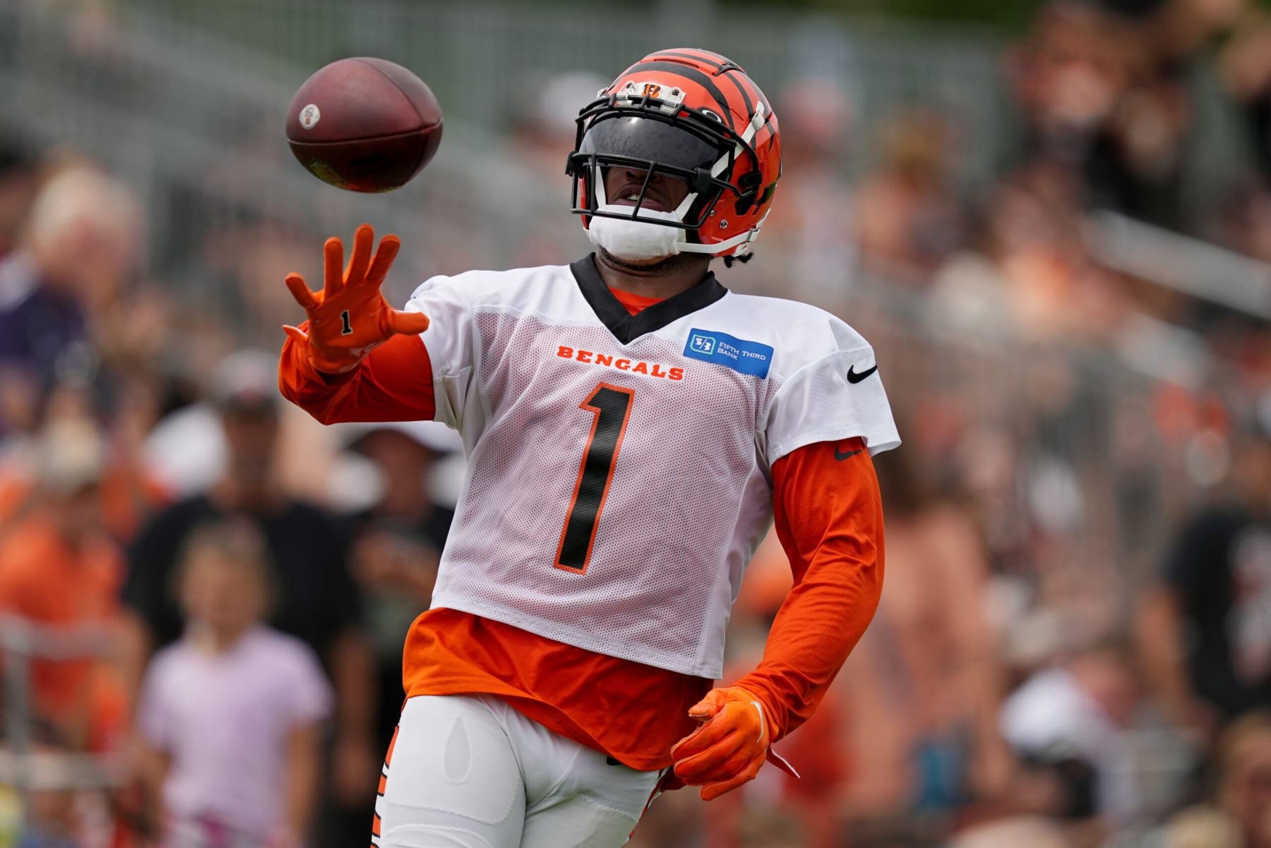 CINCINNATI, OHIO - JULY 28: Ja'Marr Chase #1 of the Cincinnati Bengals tosses the ball during training camp at Kettering Health Practice Fields on July 28, 2023 in Cincinnati, Ohio. (Photo by Dylan Buell/Getty Images) CINCINNATI, OHIO - JULY 28: Ja'Marr Chase #1 of the Cincinnati Bengals tosses the ball during training camp at Kettering Health Practice Fields on July 28, 2023 in Cincinnati, Ohio. (Photo by Dylan Buell/Getty Images)