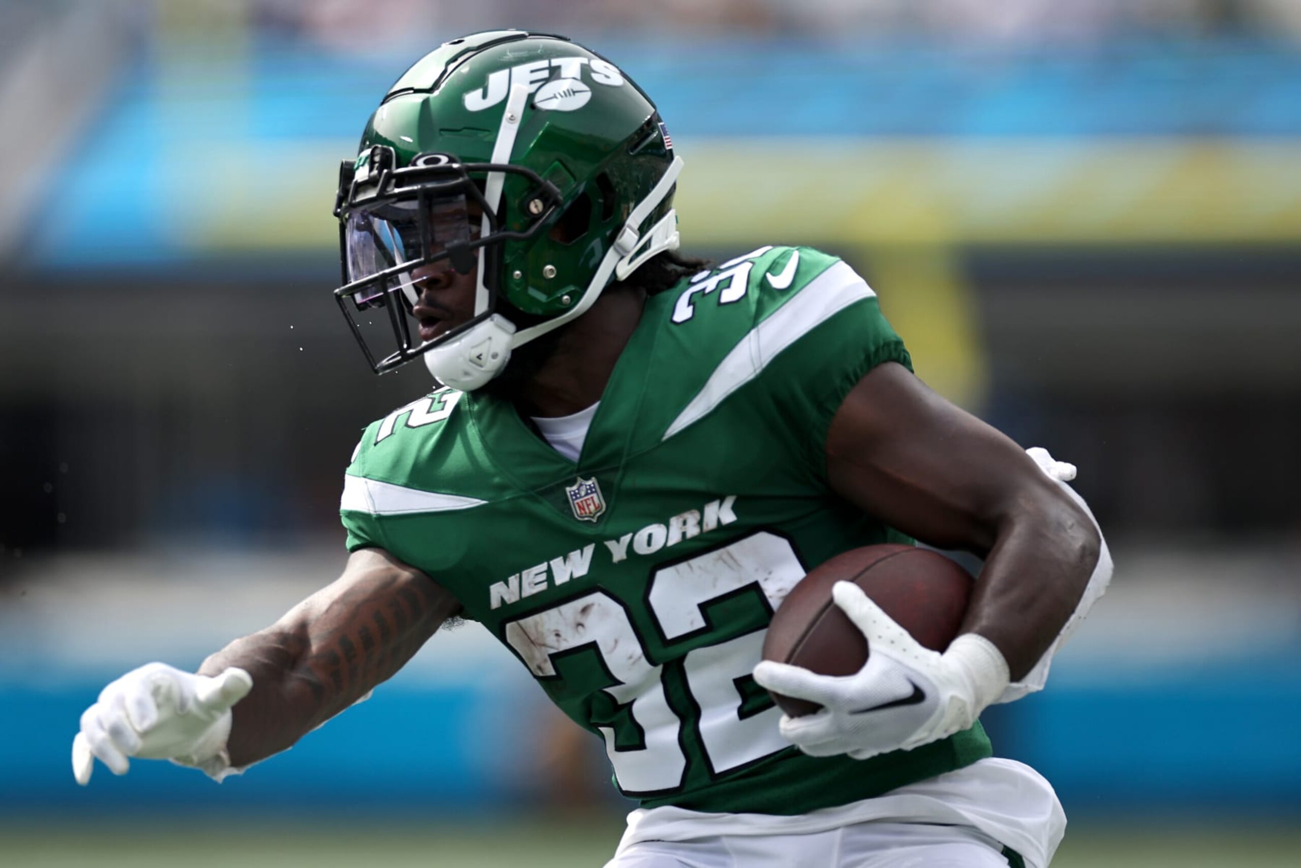 CHARLOTTE, NORTH CAROLINA - AUGUST 12: Michael Carter #32 of the New York Jets carries the ball following a reception during the first quarter of a preseason game against the Carolina Panthers at Bank of America Stadium on August 12, 2023 in Charlotte, North Carolina. (Photo by Jared C. Tilton/Getty Images)