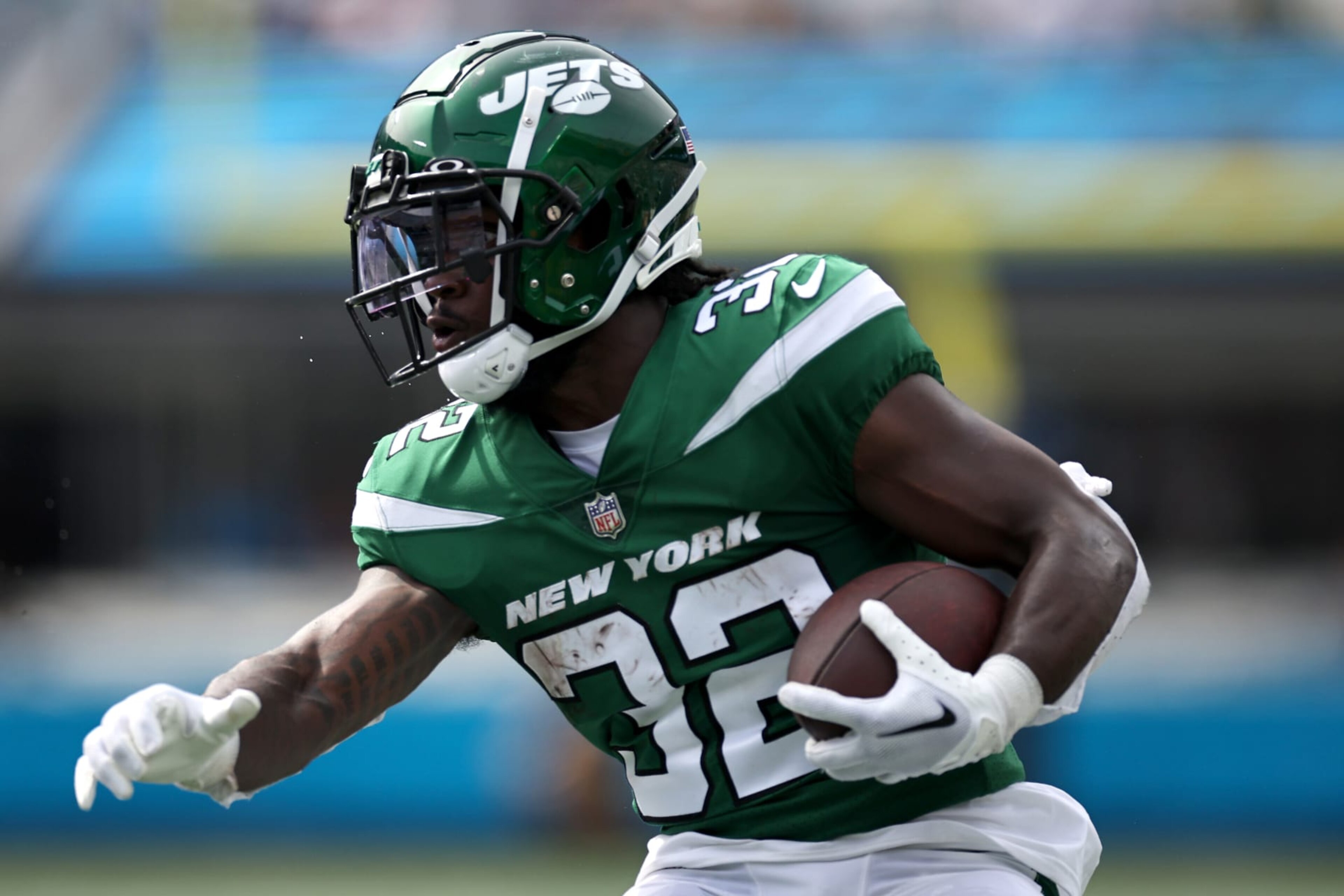 CHARLOTTE, NORTH CAROLINA - AUGUST 12: Michael Carter #32 of the New York Jets carries the ball following a reception during the first quarter of a preseason game against the Carolina Panthers at Bank of America Stadium on August 12, 2023 in Charlotte, North Carolina. (Photo by Jared C. Tilton/Getty Images)