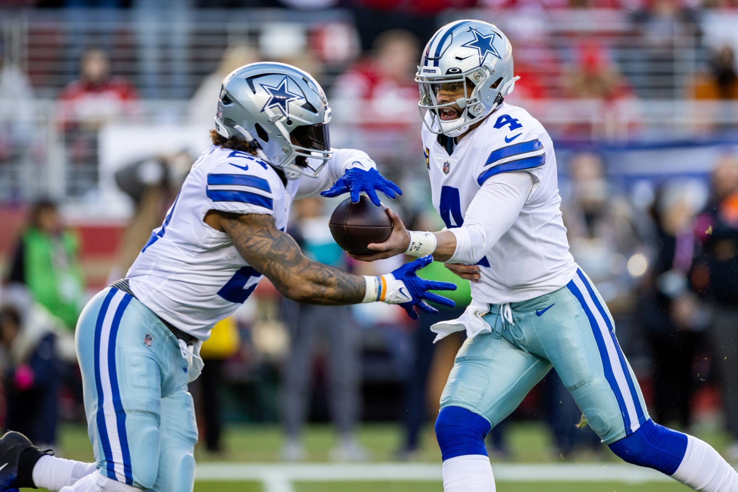 SANTA CLARA, CA - JANUARY 22: Dallas Cowboys quarterback Dak Prescott (4) hands off to Dallas Cowboys running back Ezekiel Elliott (21) during the NFL NFC Divisional Playoff game between the Dallas Cowboys and San Francisco 49ers at Levis Stadium in Santa Clara, CA. (Photo by Bob Kupbens/Icon Sportswire via Getty Images)