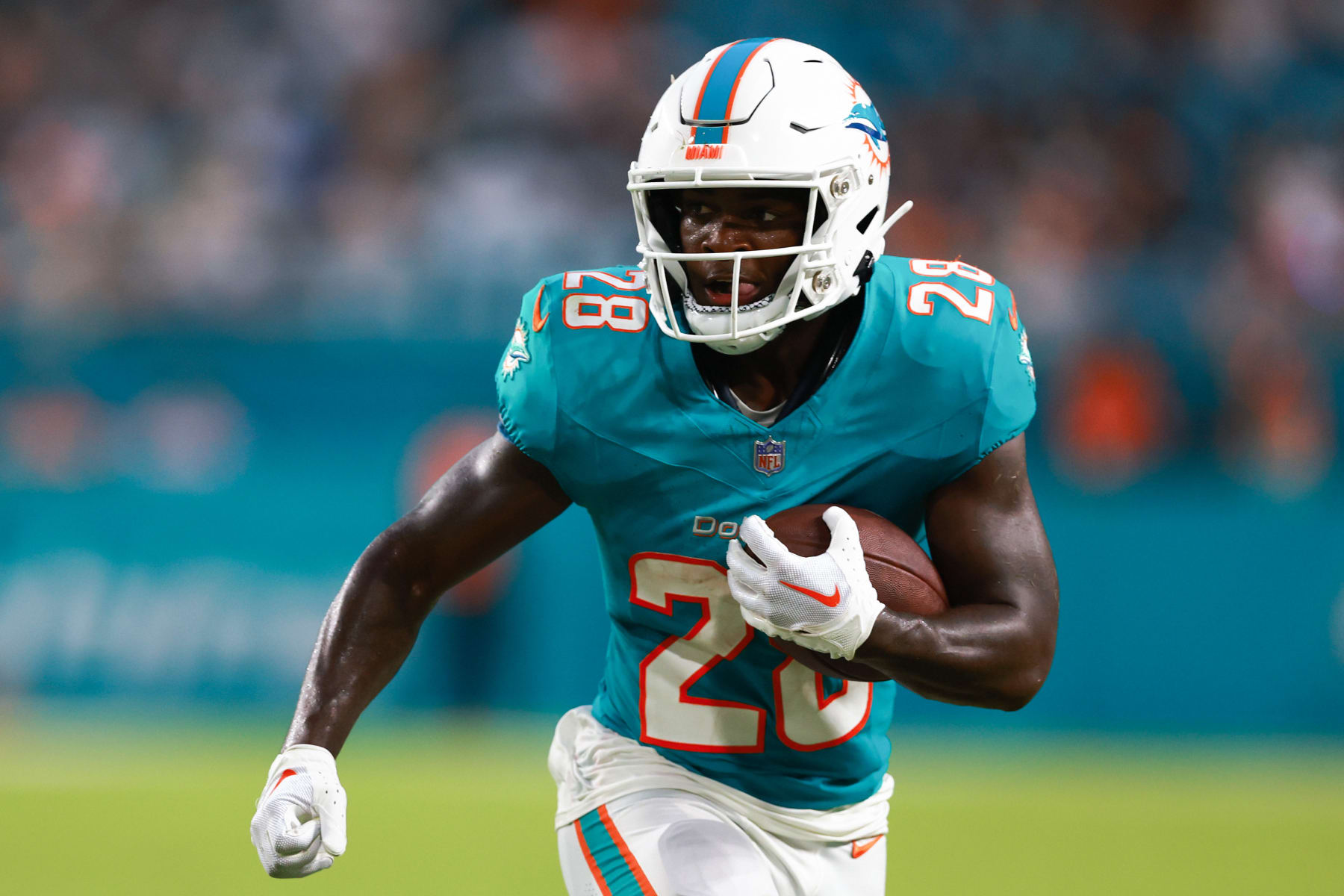 MIAMI GARDENS, FLORIDA - AUGUST 11: De'Von Achane #28 of the Miami Dolphins carries the ball against the Atlanta Falcons during the second quarter in a preseason game at Hard Rock Stadium on August 11, 2023 in Miami Gardens, Florida. (Photo by Megan Briggs/Getty Images)