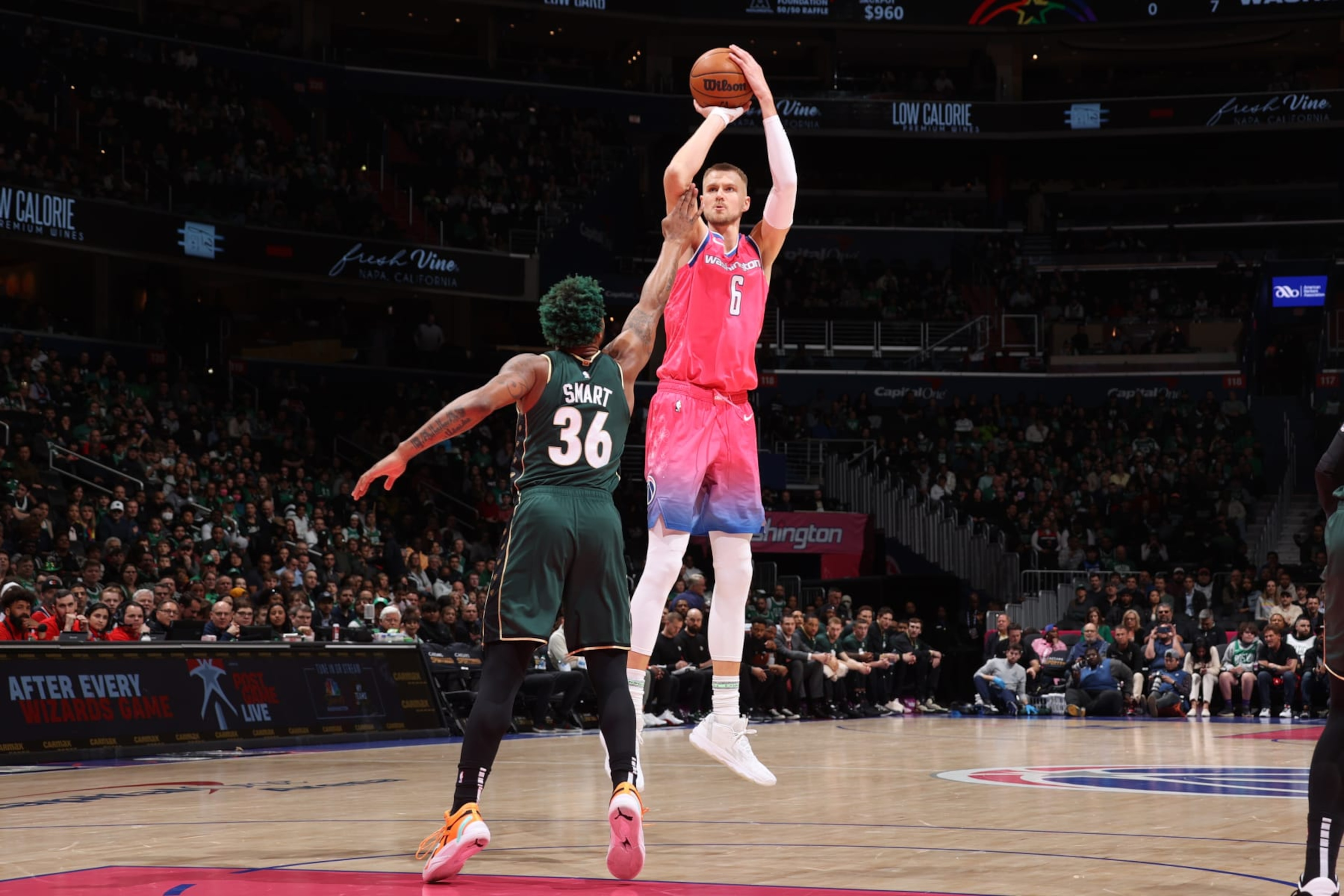 WASHINGTON, DC - MARCH 28: Kristaps Porzingis #6 of the Washington Wizards shoots the ball during the game against the Boston Celtics on March 28, 2023 at Capital One Arena in Washington, DC. NOTE TO USER: User expressly acknowledges and agrees that, by downloading and or using this Photograph, user is consenting to the terms and conditions of the Getty Images License Agreement. Mandatory Copyright Notice: Copyright 2023 NBAE (Photo by Stephen Gosling/NBAE via Getty Images) WASHINGTON, DC - MARCH 28: Kristaps Porzingis #6 of the Washington Wizards shoots the ball during the game against the Boston Celtics on March 28, 2023 at Capital One Arena in Washington, DC. NOTE TO USER: User expressly acknowledges and agrees that, by downloading and or using this Photograph, user is consenting to the terms and conditions of the Getty Images License Agreement. Mandatory Copyright Notice: Copyright 2023 NBAE (Photo by Stephen Gosling/NBAE via Getty Images)