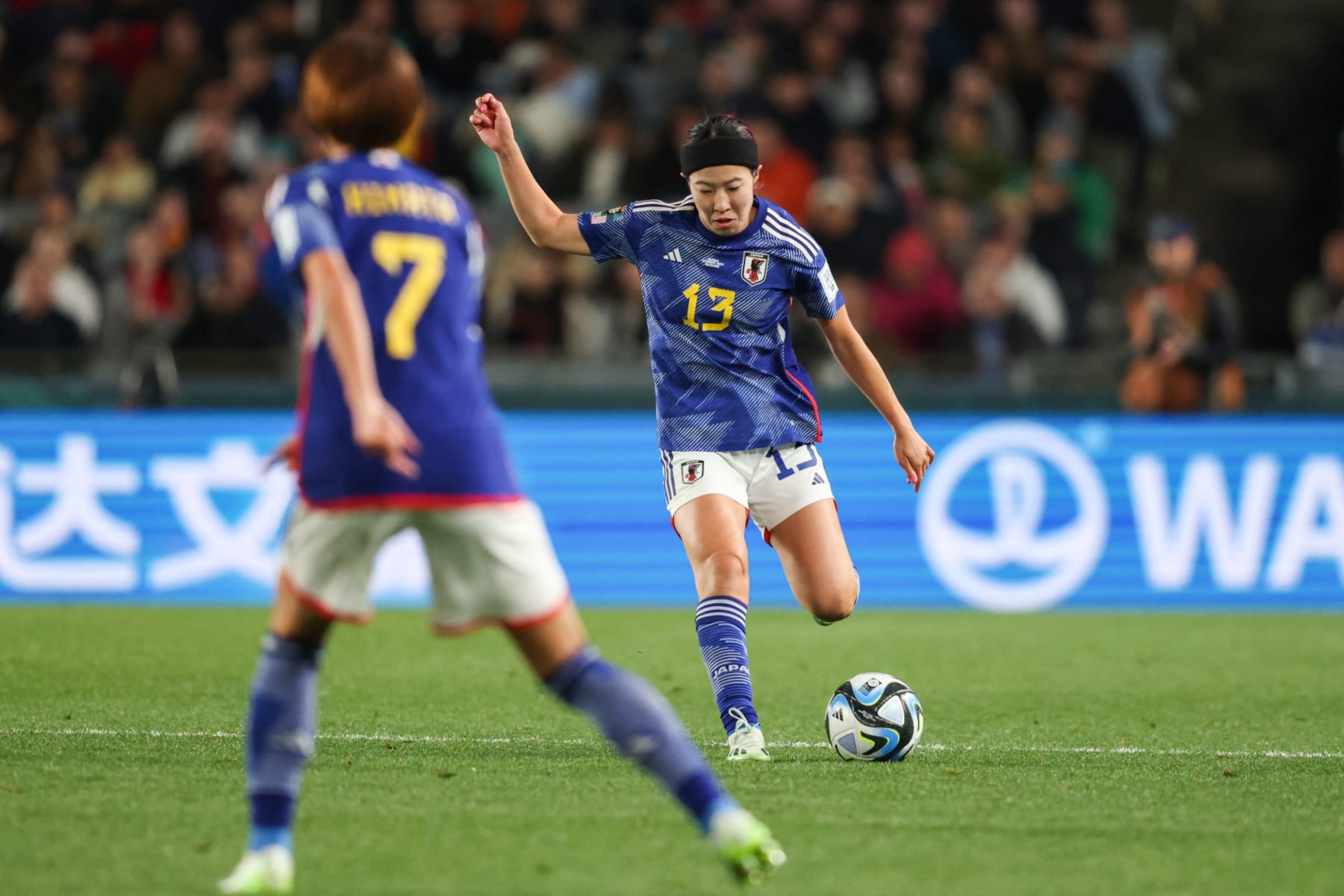 Japan's midfielder #13 Jun Endo crosses the ball during the Australia and New Zealand 2023 Women's World Cup quarter-final football match between Japan and Sweden at Eden Park in Auckland on August 11, 2023.