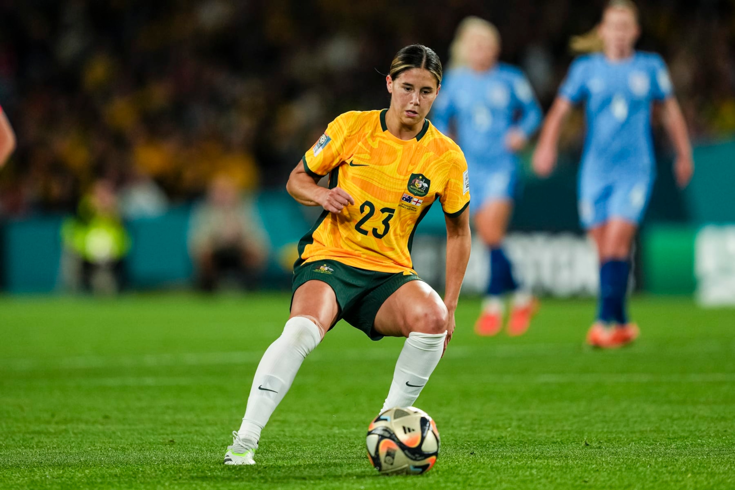 SYDNEY, AUSTRALIA - AUGUST 16: Kyra Cooney-Cross of Australia passes the ball during the FIFA Women's World Cup Australia & New Zealand 2023 Semi Final match between Australia and England at Stadium Australia on August 16, 2023 in Sydney, Australia. (Photo by Daniela Porcelli/Eurasia Sport Images/Getty Images)