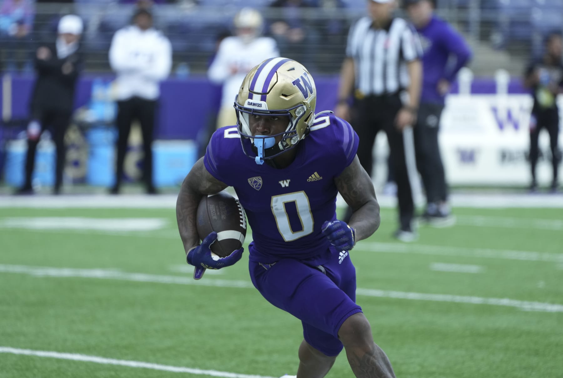 Seattle, WA - APRIL 22: Washington Husky receiver Giles Jackson (0) runs the ball during the Washington Husky Spring game on April 22, 2023 at Husky Stadium in Seattle, WA. (Photo by Jeff Halstead/Icon Sportswire via Getty Images)