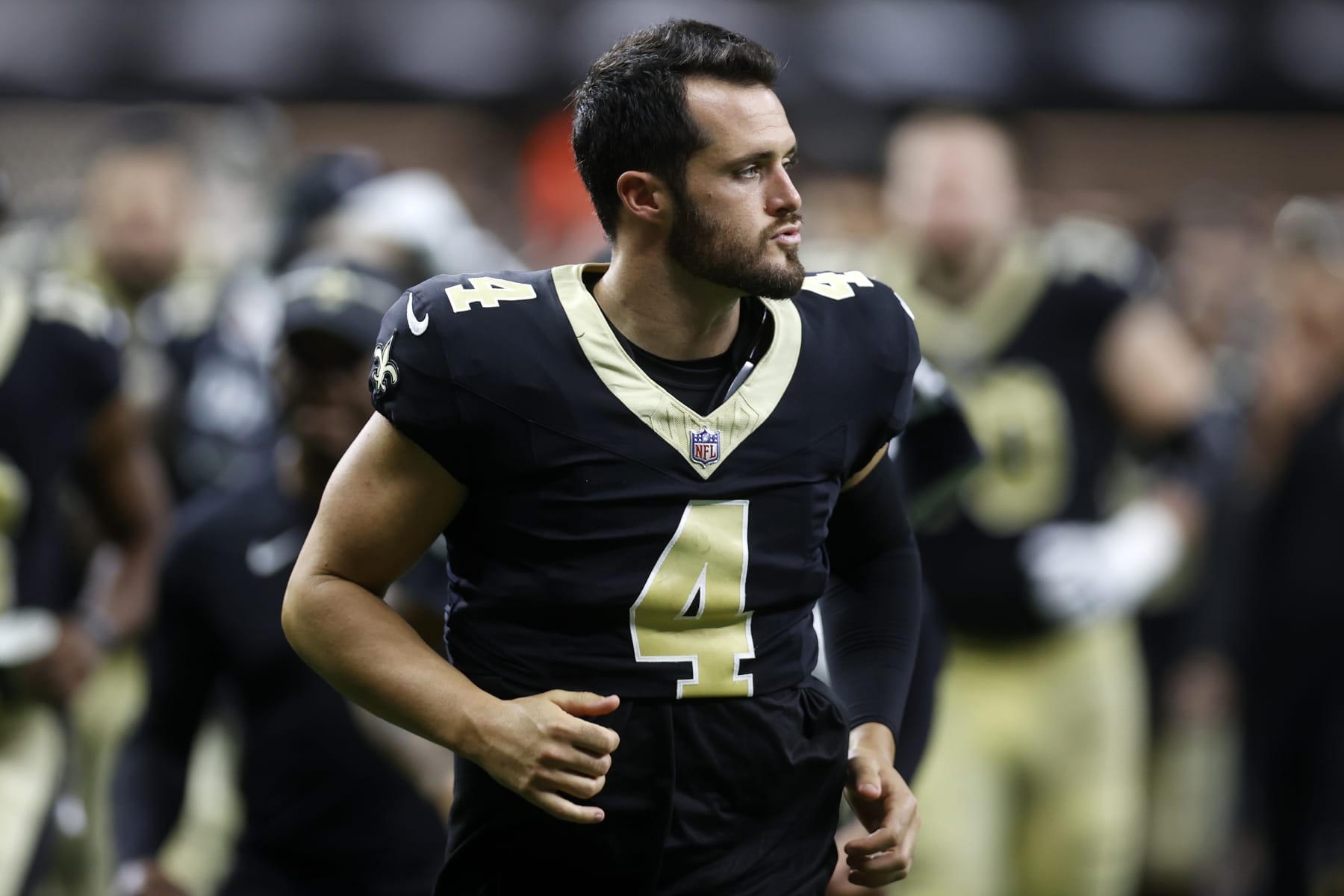 NEW ORLEANS, LOUISIANA - AUGUST 13: Derek Carr #4 of the New Orleans Saints looks on during a preseason game at Caesars Superdome on August 13, 2023 in New Orleans, Louisiana. (Photo by Chris Graythen/Getty Images)