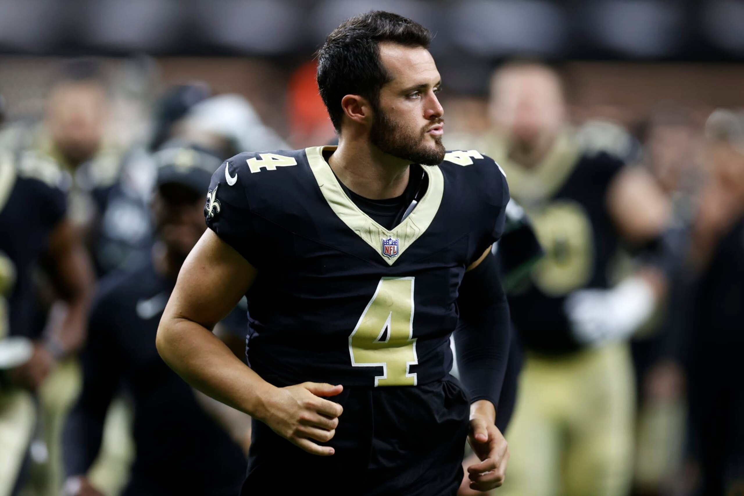 NEW ORLEANS, LOUISIANA - AUGUST 13: Derek Carr #4 of the New Orleans Saints looks on during a preseason game at Caesars Superdome on August 13, 2023 in New Orleans, Louisiana. (Photo by Chris Graythen/Getty Images)