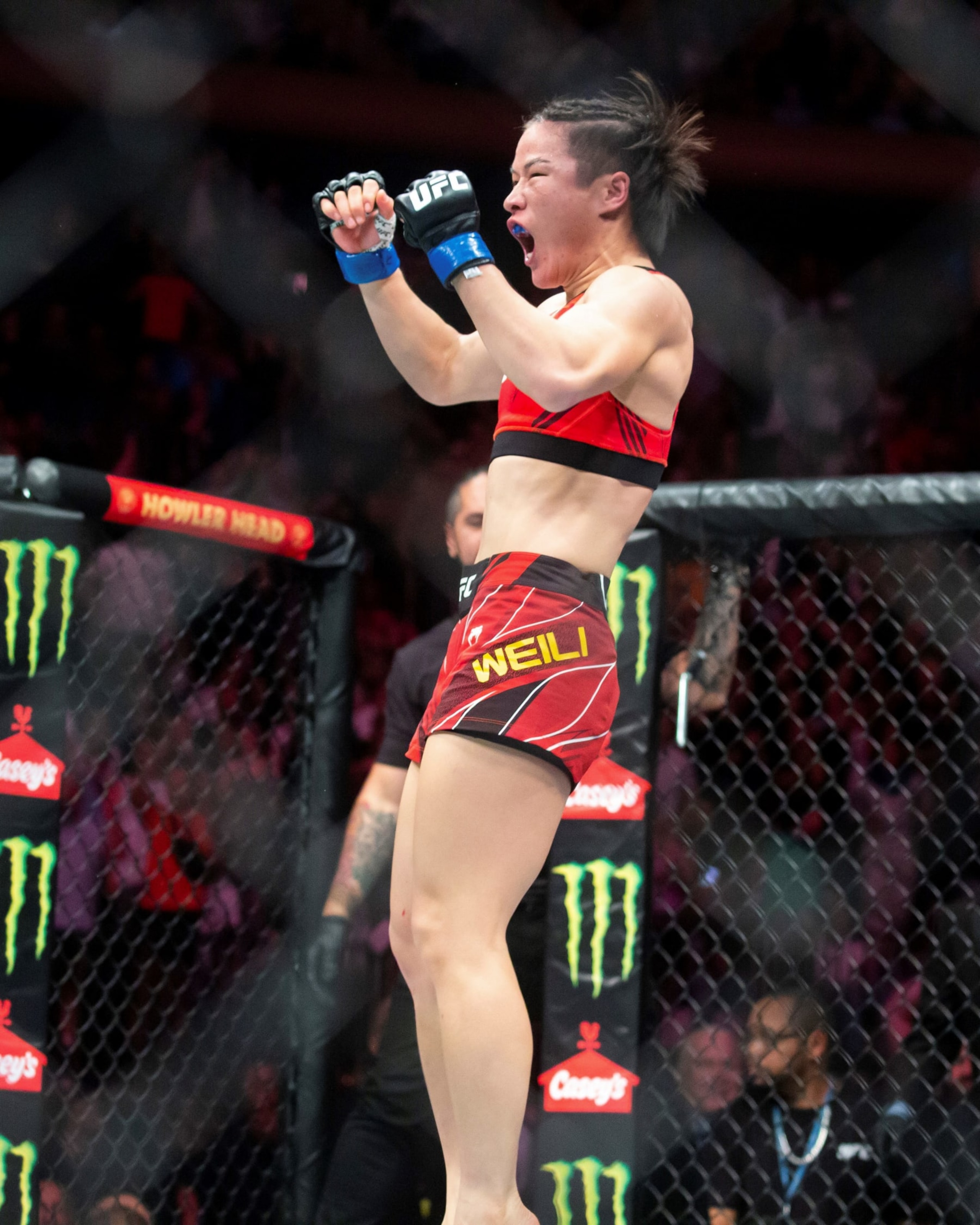 Zhang Weili of China celebrates after winning the women's strawweight title bout against Carla Esparza of the United States at the UFC 281 in Madison Square Garden in New York, the United States, Nov. 12, 2022. China's first UFC champion Zhang Weili reclaimed women's strawweight champion with a second-round submission on Carla Esparza at UFC 281 on Saturday night. (Photo by Michael Nagle/Xinhua via Getty Images)