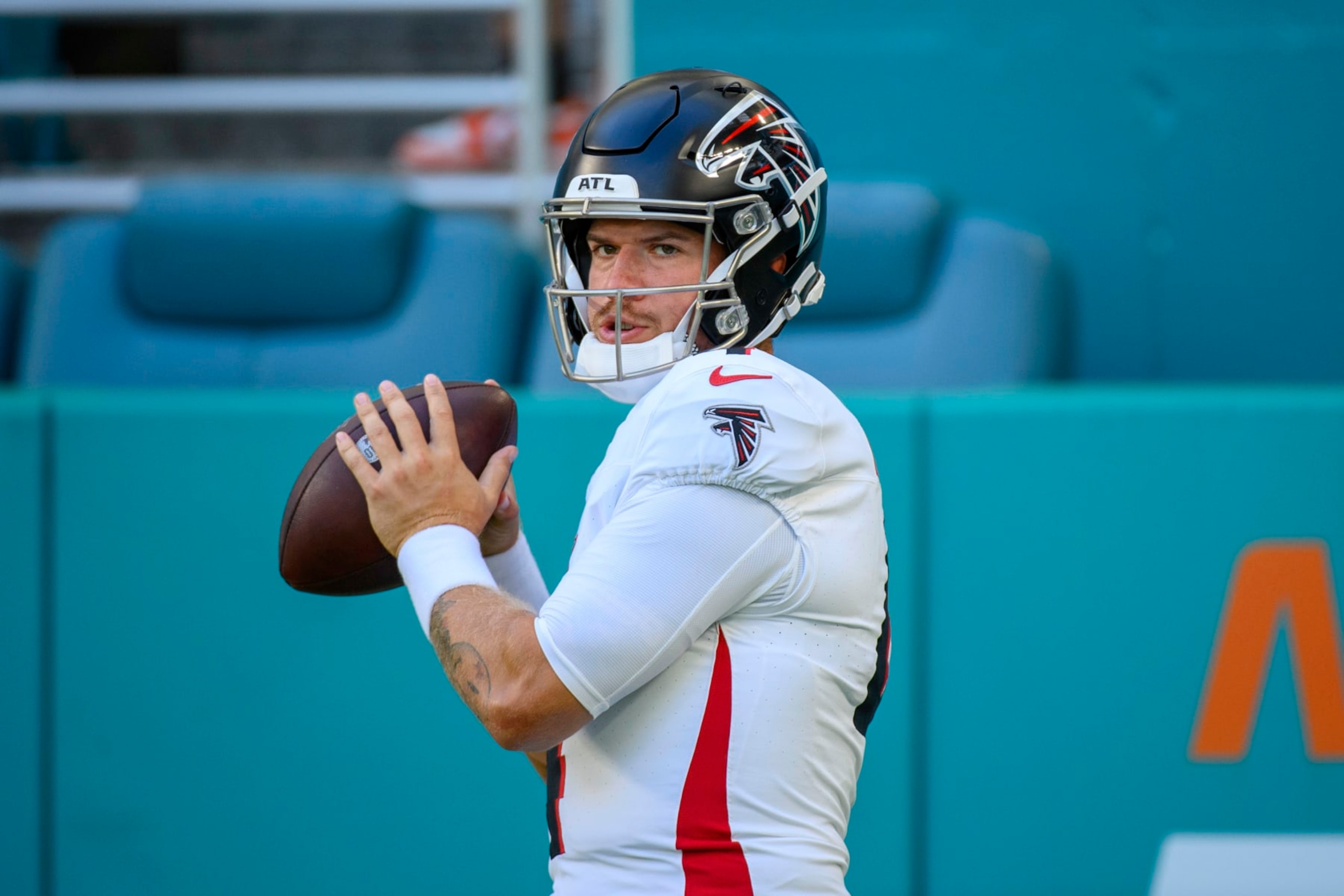Atlanta Falcons quarterback Taylor Heinicke (4) throws the ball as he practices on the field before an NFL pre-season football game against the Miami Dolphins, Friday, Aug. 11, 2023, in Miami Gardens, Fla. (AP Photo/Doug Murray)
