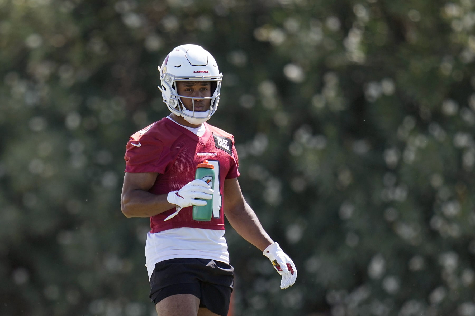 Arizona Cardinals wide receiver Rondale Moore pauses on the sideline during mini camp practice at the team's NFL football training facility Tuesday, June 13, 2023, in Tempe, Ariz. (AP Photo/Ross D. Franklin)