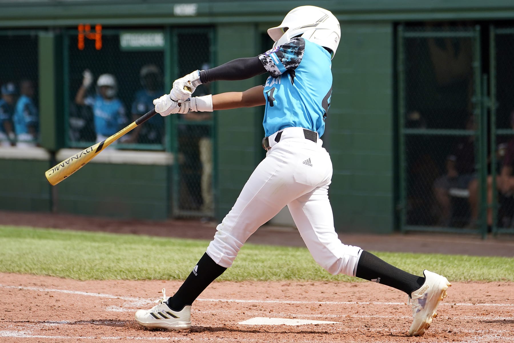 Curacao's Jayvery Felicia (4) follows through on his swing as he drove in the game winning run against Australia during the fifth inning of a baseball game at the Little League World Series tournament in South Williamsport, Pa., Thursday, Aug. 17, 2023. Curacao won the game 2-1. (AP Photo/Tom E. Puskar)