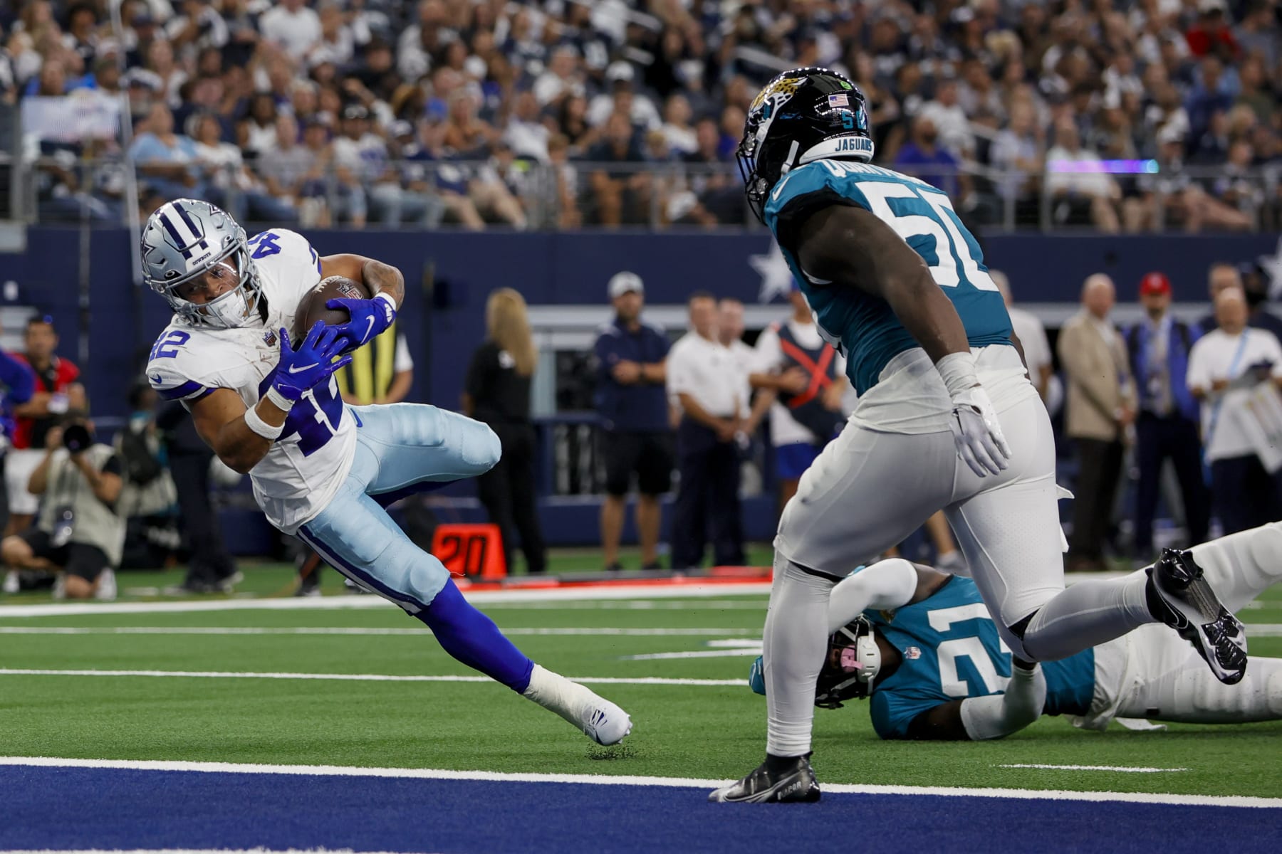 ARLINGTON, TX - AUGUST 12: Dallas Cowboys running back Deuce Vaughn (42) scores a touchdown during the preseason game between the Dallas Cowboys and the Jacksonville Jaguars on August 12, 2023 at AT&T Stadium in Arlington, Texas. (Photo by Matthew Pearce/Icon Sportswire via Getty Images)