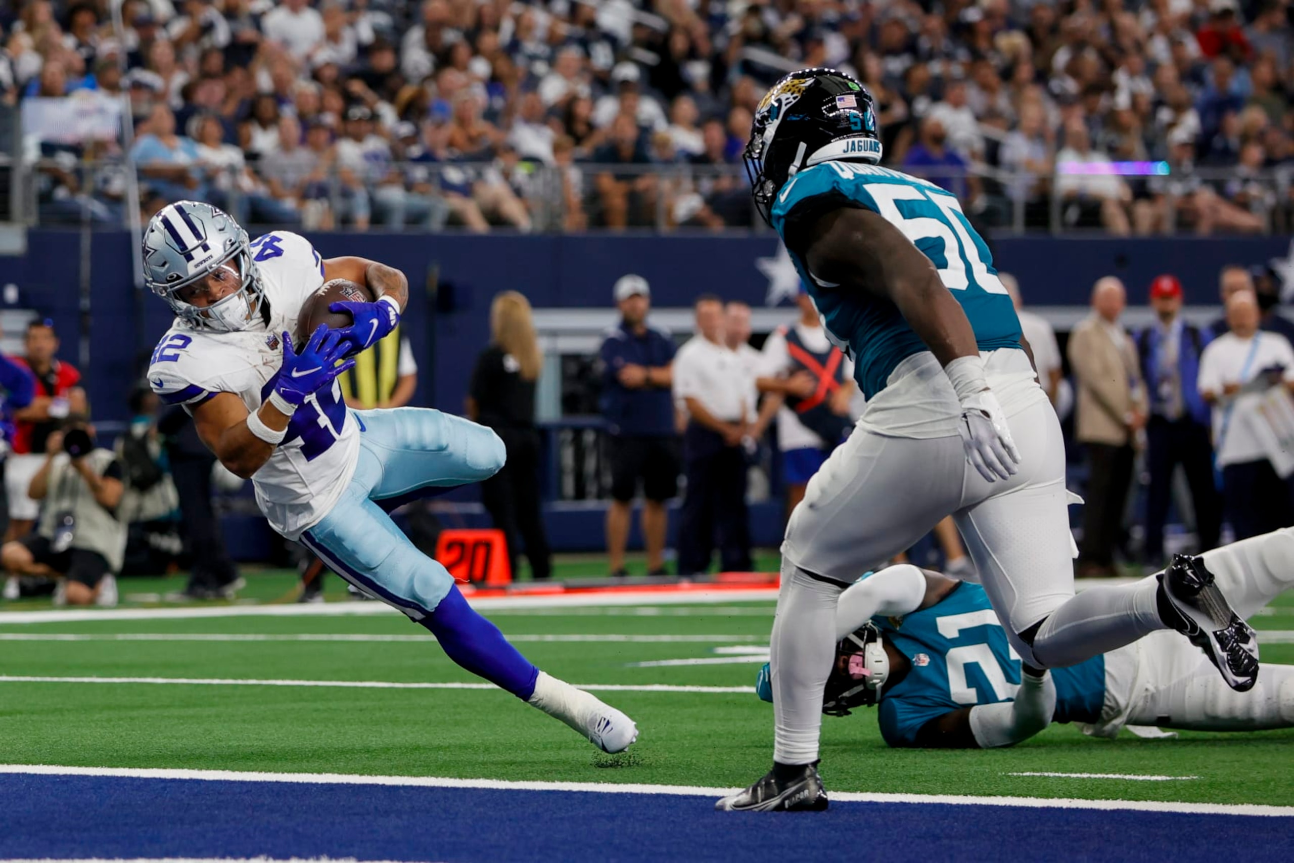 ARLINGTON, TX - AUGUST 12: Dallas Cowboys running back Deuce Vaughn (42) scores a touchdown during the preseason game between the Dallas Cowboys and the Jacksonville Jaguars on August 12, 2023 at AT&T Stadium in Arlington, Texas. (Photo by Matthew Pearce/Icon Sportswire via Getty Images)