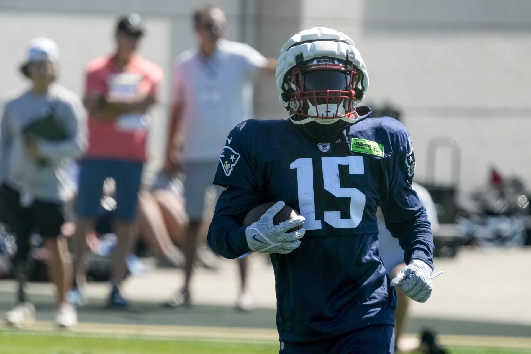 New England Patriots' Ezekiel Elliott runs a drill during practice for NFL football training camp Wednesday, Aug. 16, 2023, in Green Bay, Wis. (AP Photo/Morry Gash)