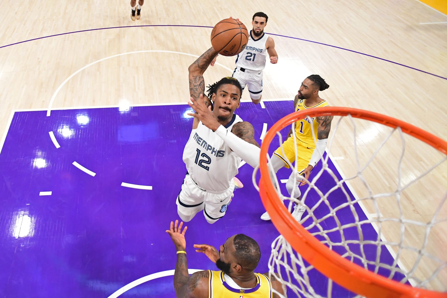 LOS ANGELES, CA - APRIL 28: Ja Morant #12 of the Memphis Grizzlies drives to the basket against the Los Angeles Lakers during round One Game Six of the 2023 NBA Playoffs on April 28, 2023 at Crypto.Com Arena in Los Angeles, California. NOTE TO USER: User expressly acknowledges and agrees that, by downloading and/or using this Photograph, user is consenting to the terms and conditions of the Getty Images License Agreement. Mandatory Copyright Notice: Copyright 2023 NBAE (Photo by Adam Pantozzi/NBAE via Getty Images)