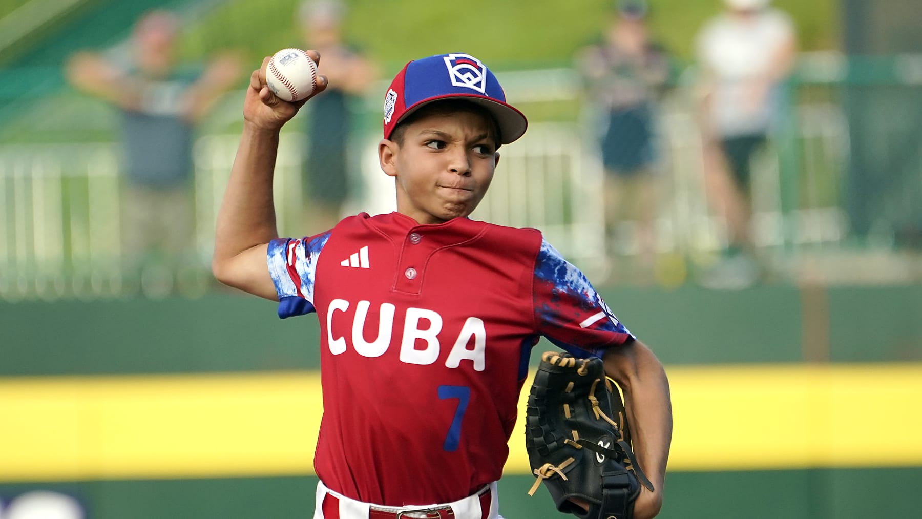 Cuba's Edgar Torrez (7) delivers a pitch against Japan during the fifth inning of a baseball game at the Little League World Series tournament in South Williamsport, Pa., Wednesday, Aug. 16, 2023. Japan won the game 1-0. (AP Photo/Tom E. Puskar)