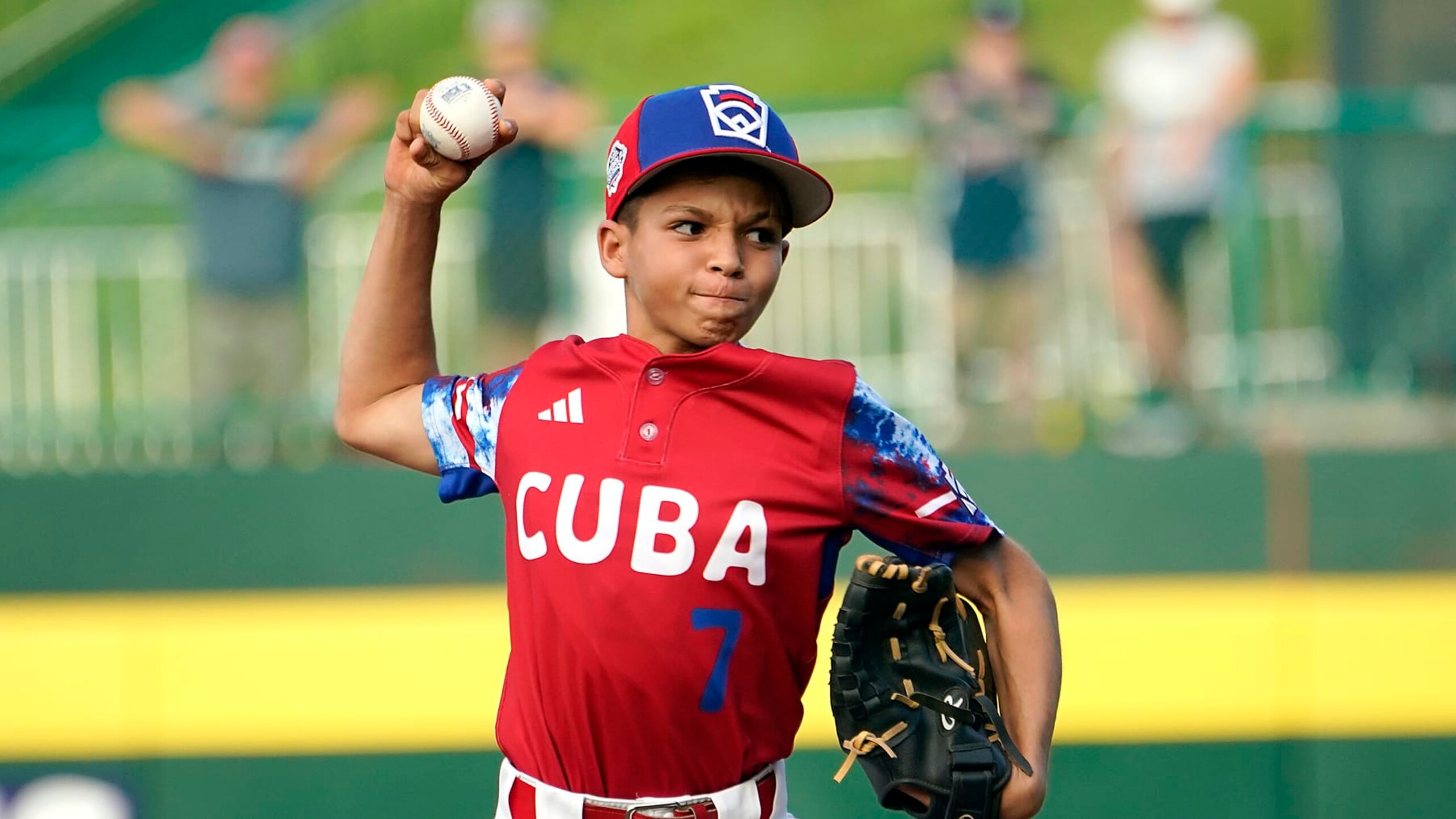 Cuba's Edgar Torrez (7) delivers a pitch against Japan during the fifth inning of a baseball game at the Little League World Series tournament in South Williamsport, Pa., Wednesday, Aug. 16, 2023. Japan won the game 1-0. (AP Photo/Tom E. Puskar)