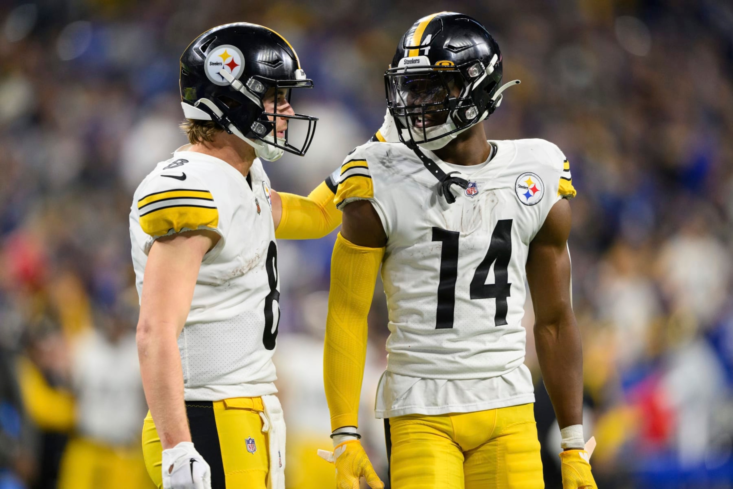 Pittsburgh Steelers wide receiver George Pickens (14) and Pittsburgh Steelers quarterback Kenny Pickett (8) talk on the field during an NFL football game against the Indianapolis Colts, Monday, Nov. 28, 2022, in Indianapolis. (AP Photo/Zach Bolinger)
