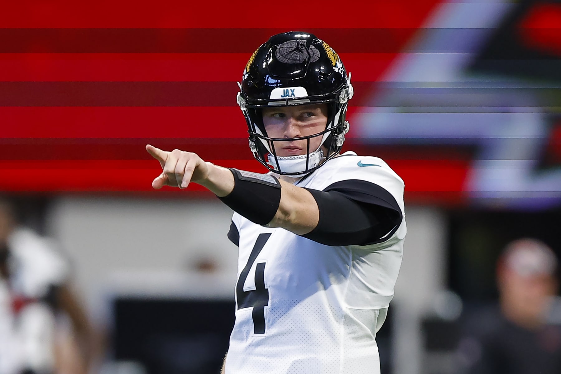 ATLANTA, GA - AUGUST 27: E.J. Perry #4 of the Jacksonville Jaguars points out a formation during the first half of the preseason game against the Atlanta Falcons at Mercedes-Benz Stadium on August 27, 2022 in Atlanta, Georgia. (Photo by Todd Kirkland/Getty Images)