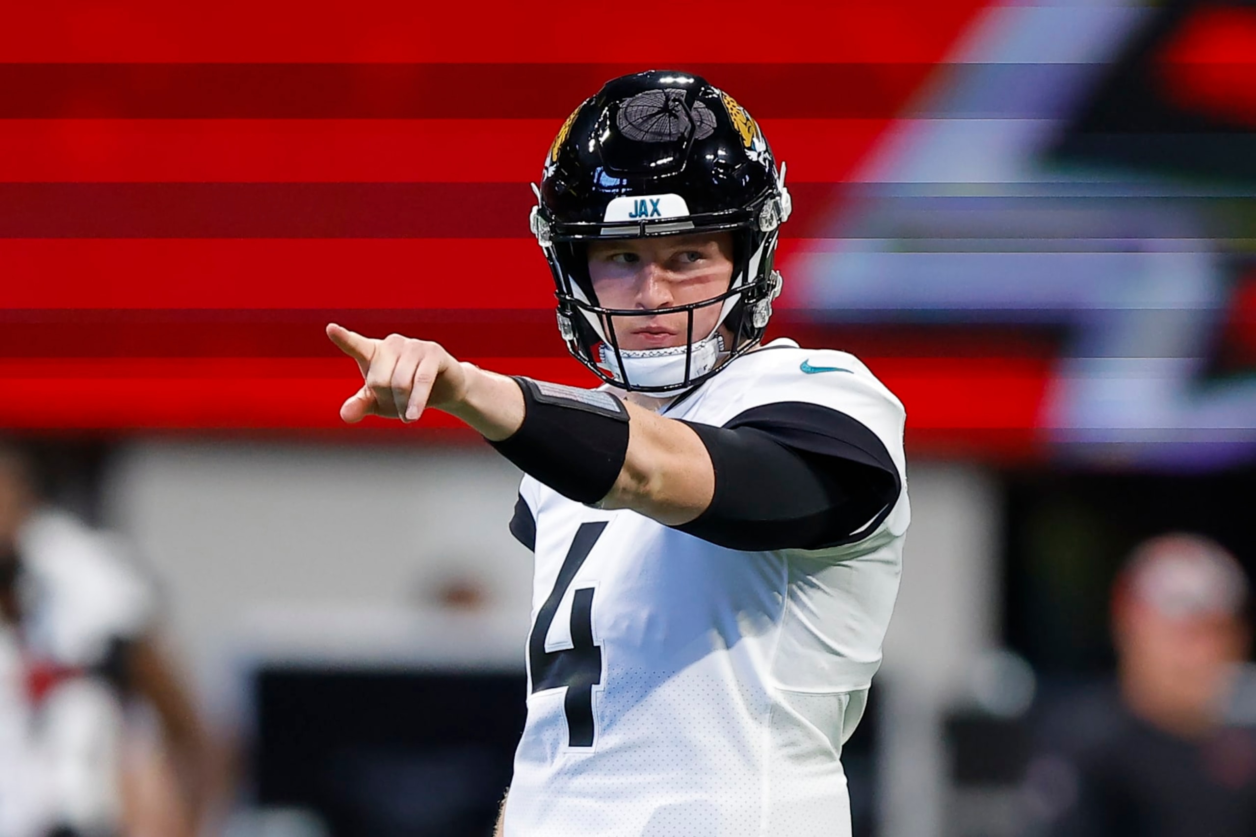 ATLANTA, GA - AUGUST 27: E.J. Perry #4 of the Jacksonville Jaguars points out a formation during the first half of the preseason game against the Atlanta Falcons at Mercedes-Benz Stadium on August 27, 2022 in Atlanta, Georgia. (Photo by Todd Kirkland/Getty Images)