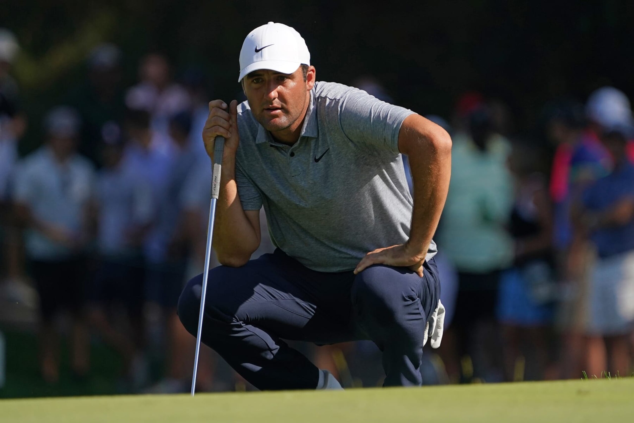 OLYMPIA FIELDS, ILLINOIS - AUGUST 19: Scottie Scheffler of the United States lines up a putt on the 16th green during the third round of the BMW Championship at Olympia Fields Country Club on August 19, 2023 in Olympia Fields, Illinois. (Photo by Dylan Buell/Getty Images)