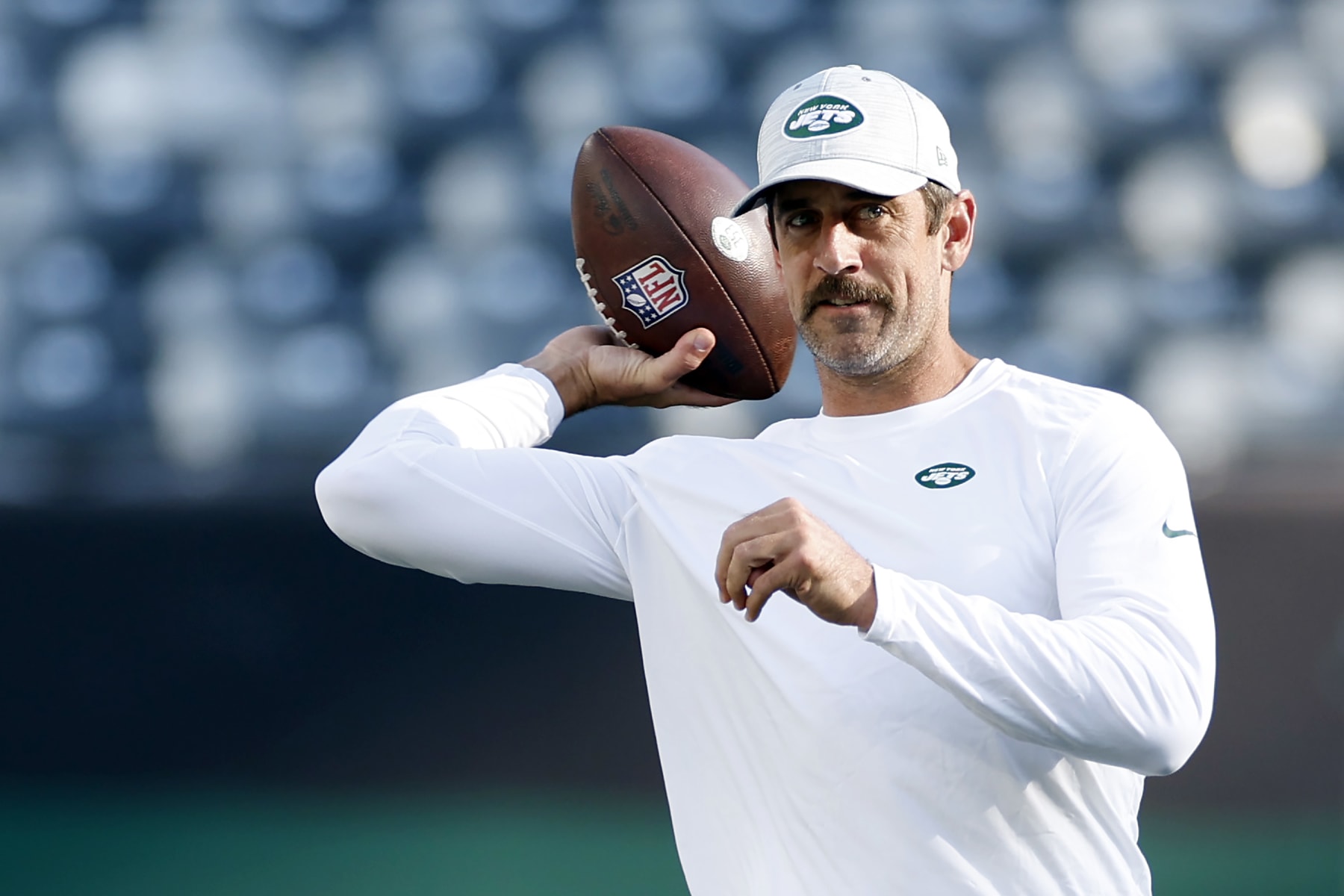 EAST RUTHERFORD, NEW JERSEY - AUGUST 19: Aaron Rodgers #8 of the New York Jets throws the ball during warmups before the first half of a preseason game against the Tampa Bay Buccaneers at MetLife Stadium on August 19, 2023 in East Rutherford, New Jersey. (Photo by Sarah Stier/Getty Images)