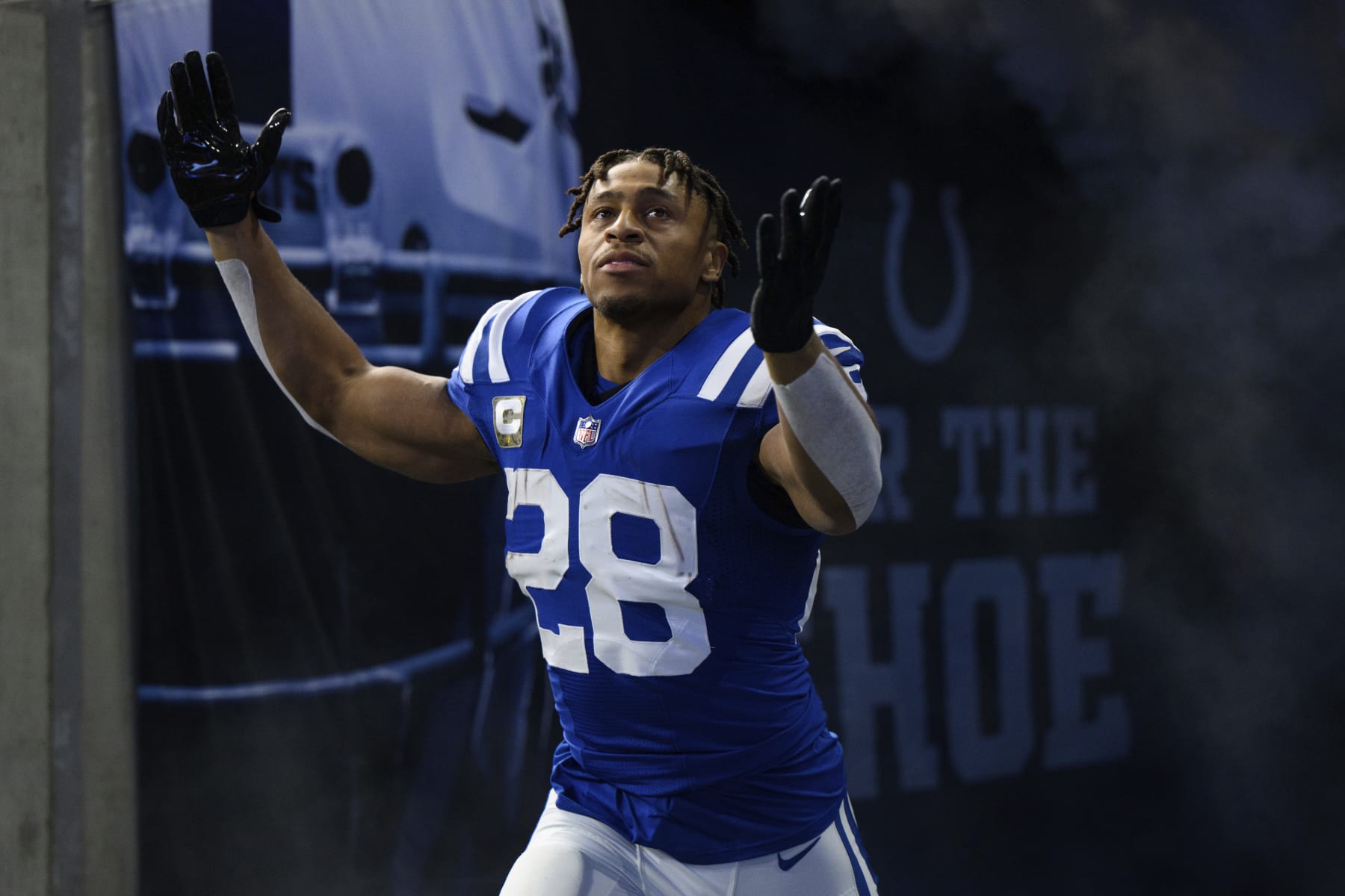 Indianapolis Colts running back Jonathan Taylor (28) gets introduced before an NFL football game against the Philadelphia Eagles, Sunday, Nov. 20, 2022, in Indianapolis. (AP Photo/Zach Bolinger)