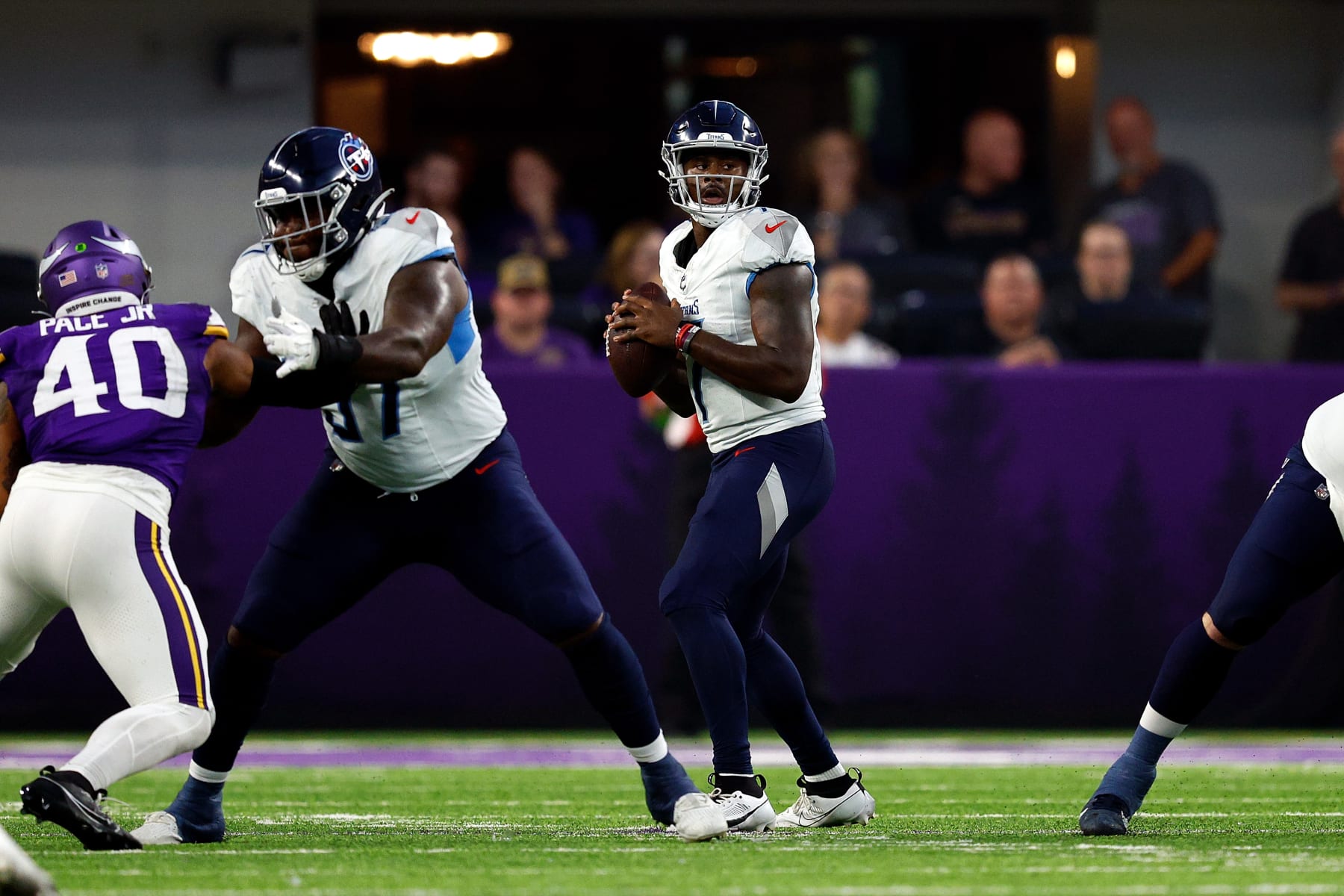 MINNEAPOLIS, MINNESOTA - AUGUST 19: Malik Willis #7 of the Tennessee Titans looks to pass against the Minnesota Vikings in the first half during a preseason game at U.S. Bank Stadium on August 19, 2023 in Minneapolis, Minnesota. (Photo by David Berding/Getty Images)