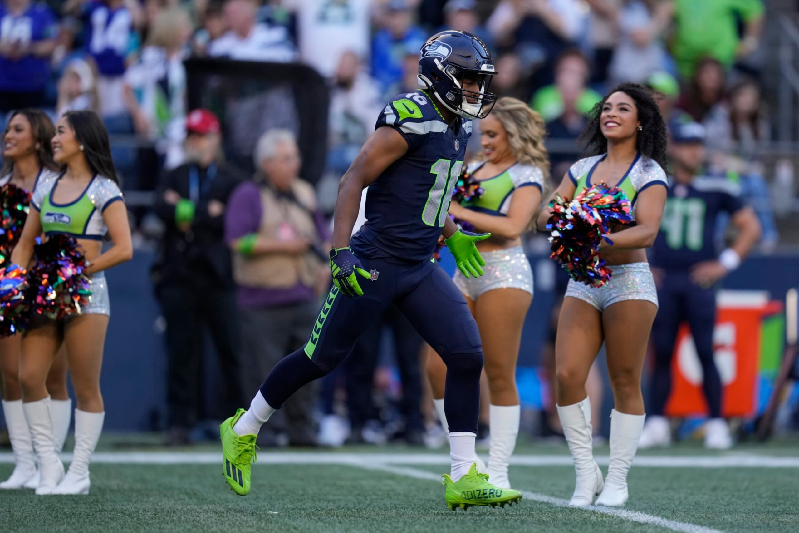 Seattle Seahawks wide receiver Tyler Lockett (16) runs on the field before an NFL pre-season football game against the Minnesota Vikings, Thursday, Aug. 10, 2023 in Seattle. (AP Photo/Ben VanHouten)