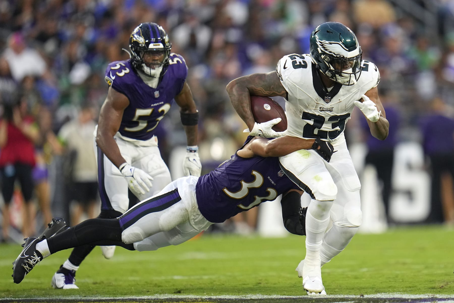 Philadelphia Eagles running back Rashaad Penny (23) runs against Baltimore Ravens cornerback Jordan Swann (33) during the first half of an NFL preseason football game in Baltimore, Saturday, Aug. 12, 2023. (AP Photo/Julio Cortez)