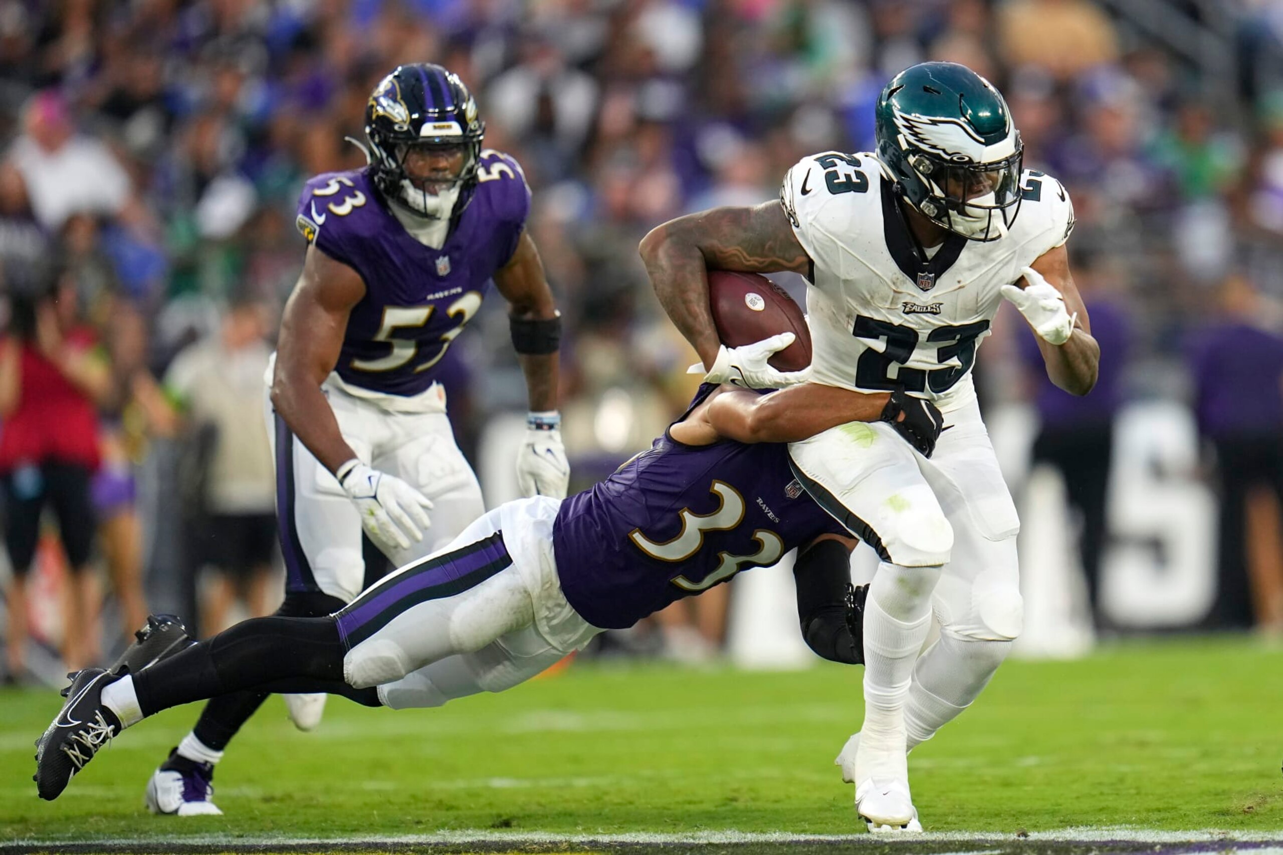 Philadelphia Eagles running back Rashaad Penny (23) runs against Baltimore Ravens cornerback Jordan Swann (33) during the first half of an NFL preseason football game in Baltimore, Saturday, Aug. 12, 2023. (AP Photo/Julio Cortez)
