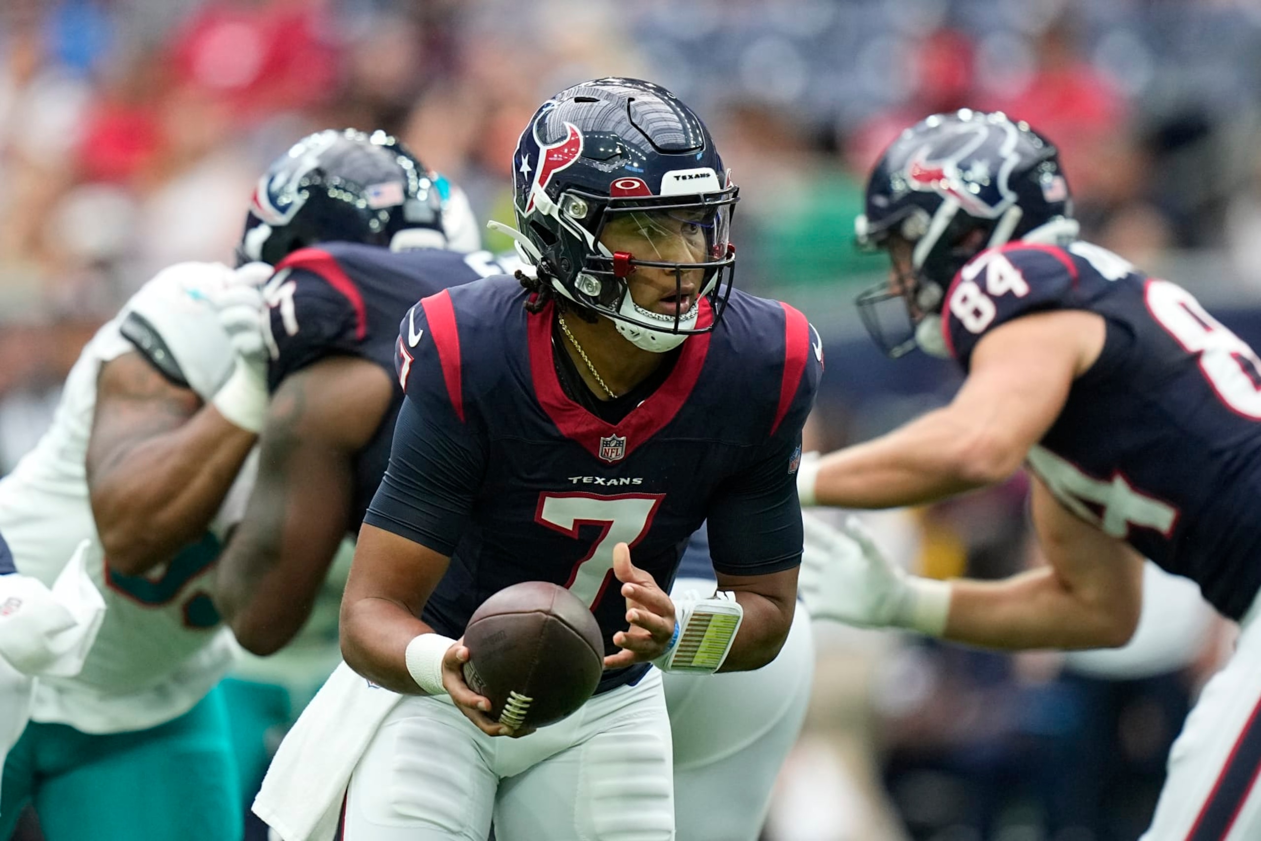 Houston Texans quarterback C.J. Stroud prepares to hand off the ball against the Miami Dolphins during the first half of an NFL preseason football game, Saturday, Aug. 19, 2023, in Houston. (AP Photo/Eric Gay)