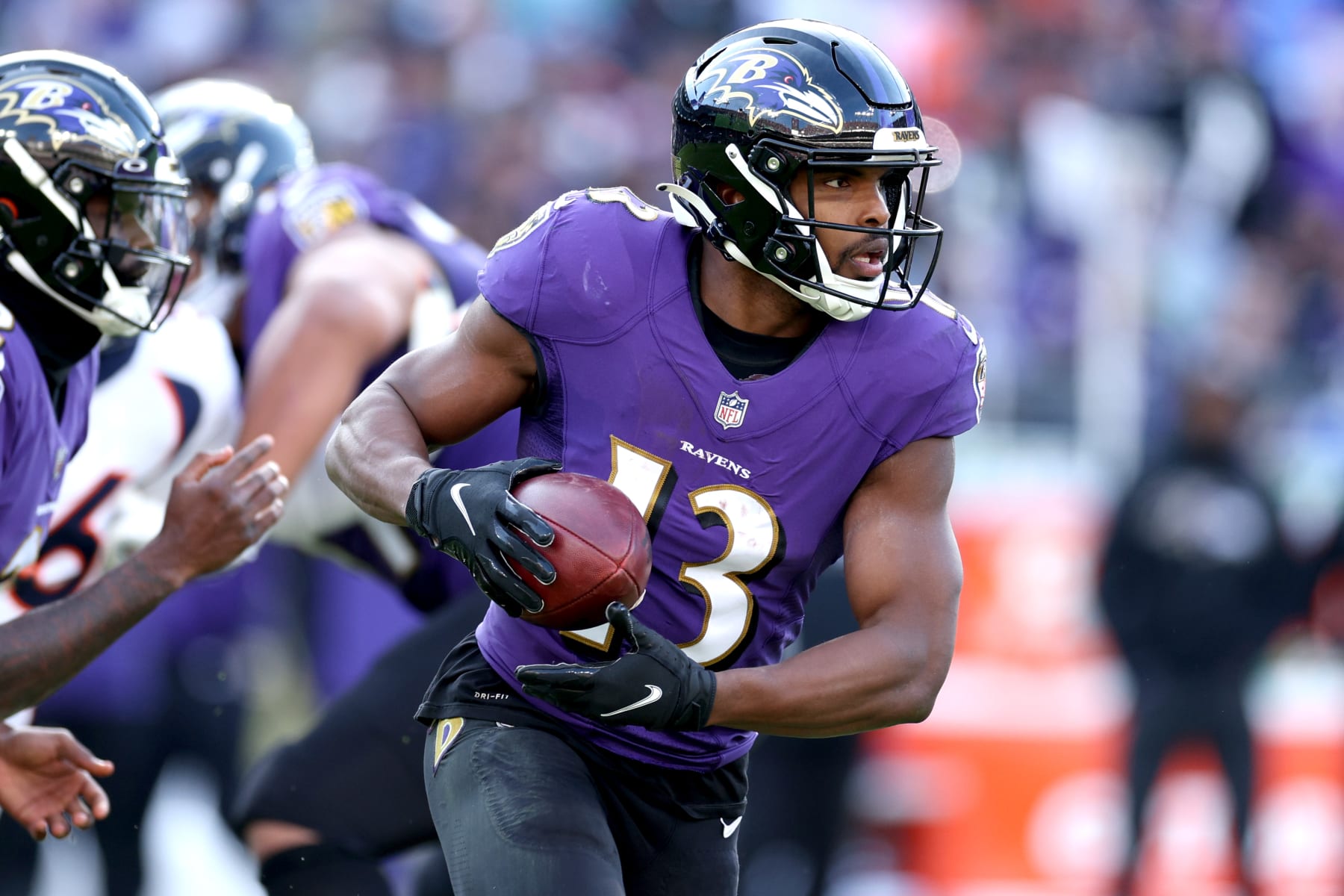 BALTIMORE, MARYLAND - DECEMBER 04: Devin Duvernay #13 of the Baltimore Ravens runs with the ball in the third quarter of a game against the Denver Broncos at M&T Bank Stadium on December 04, 2022 in Baltimore, Maryland. (Photo by Rob Carr/Getty Images)