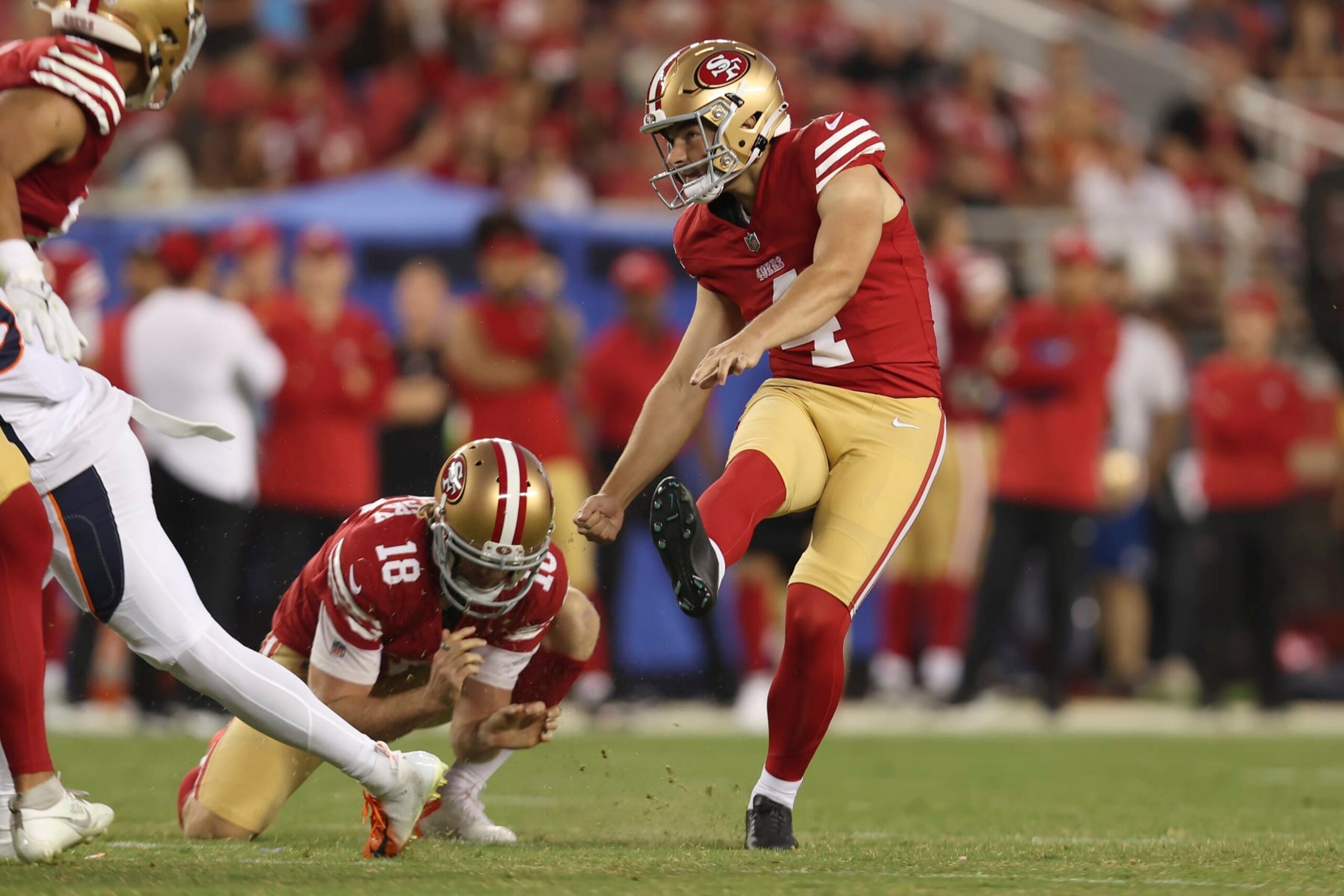San Francisco 49ers place kicker Jake Moody, right, kicks a field goal from the hold of Mitch Wishnowsky during the second half of an NFL preseason football game against the Denver Broncos in Santa Clara, Calif., Saturday, Aug. 19, 2023. (AP Photo/Jed Jacobsohn)
