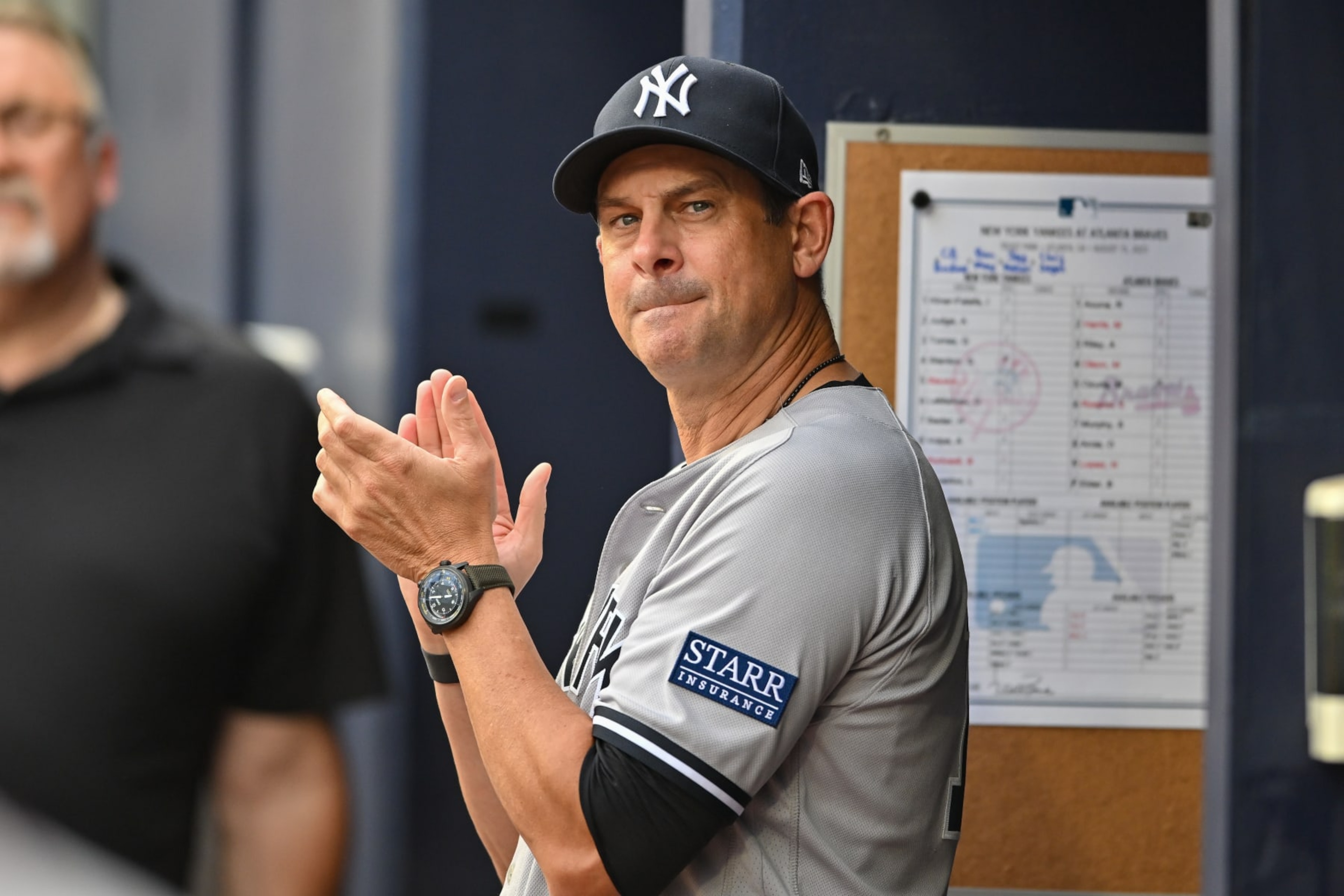 ATLANTA, GA  AUGUST 15:  New York manager Aaron Boone (17) reacts in the dugout during the MLB game between the New York Yankees and the Atlanta Braves on August 15th, 2023 at Truist Park in Atlanta, GA. (Photo by Rich von Biberstein/Icon Sportswire via Getty Images)