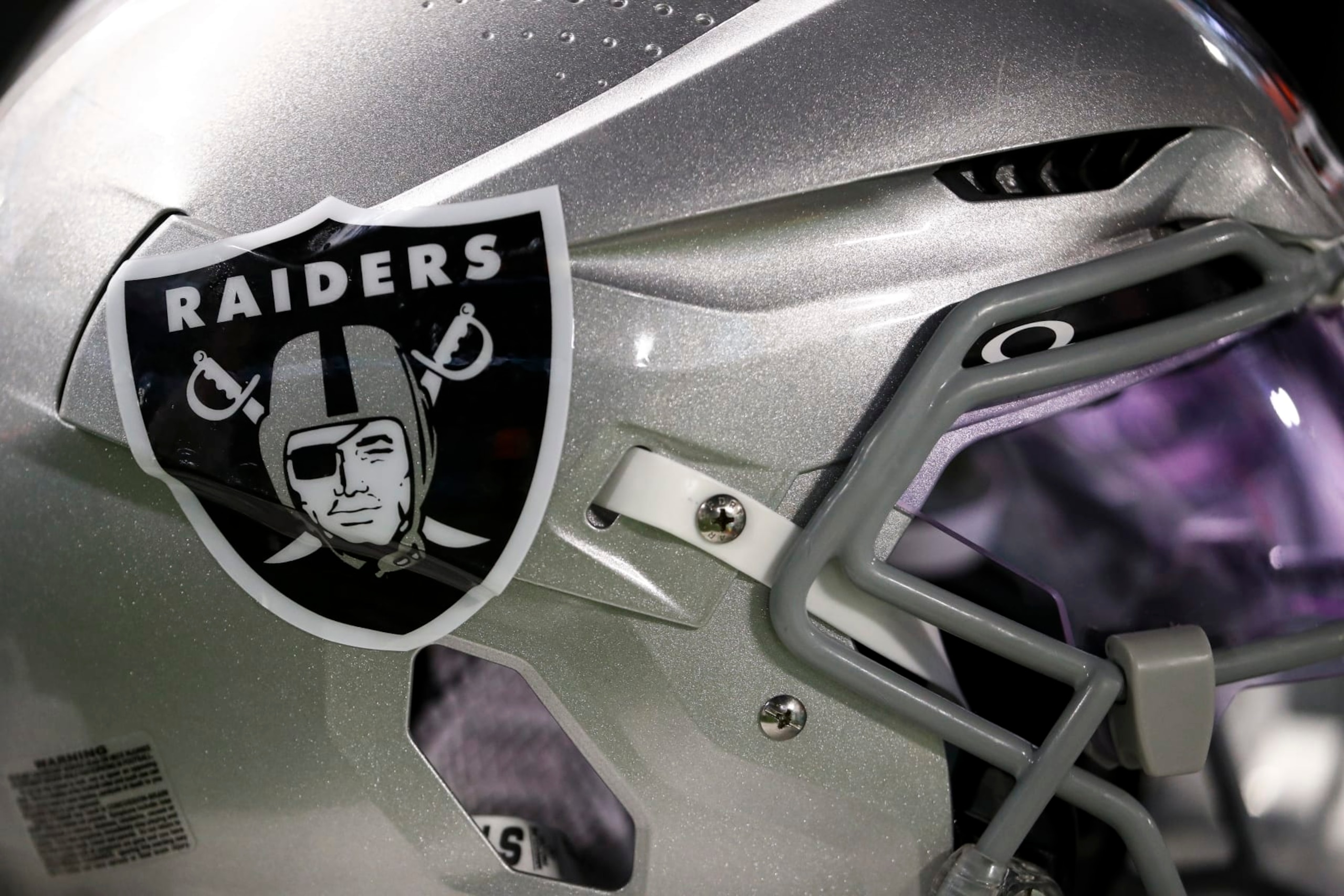 MIAMI GARDENS, FL - AUGUST 20: A detail shot of an Oakley visor logo on a Las Vegas Raiders helmet during a preseason NFL football game against the Miami Dolphins at Hard Rock Stadium on August 20, 2022 in Miami Gardens, Florida. (Photo by Kevin Sabitus/Getty Images)