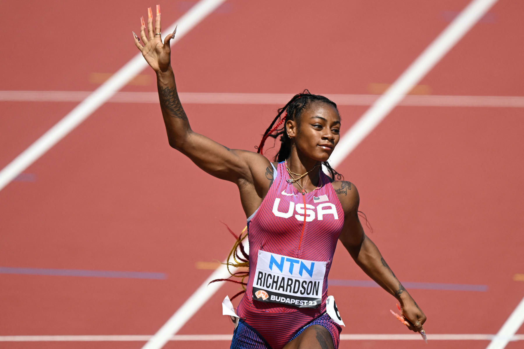 USA's Sha'Carri Richardson reacts after the women's 100m heats during the World Athletics Championships at the National Athletics Centre in Budapest on August 20, 2023. (Photo by Ferenc ISZA / AFP) (Photo by FERENC ISZA/AFP via Getty Images)