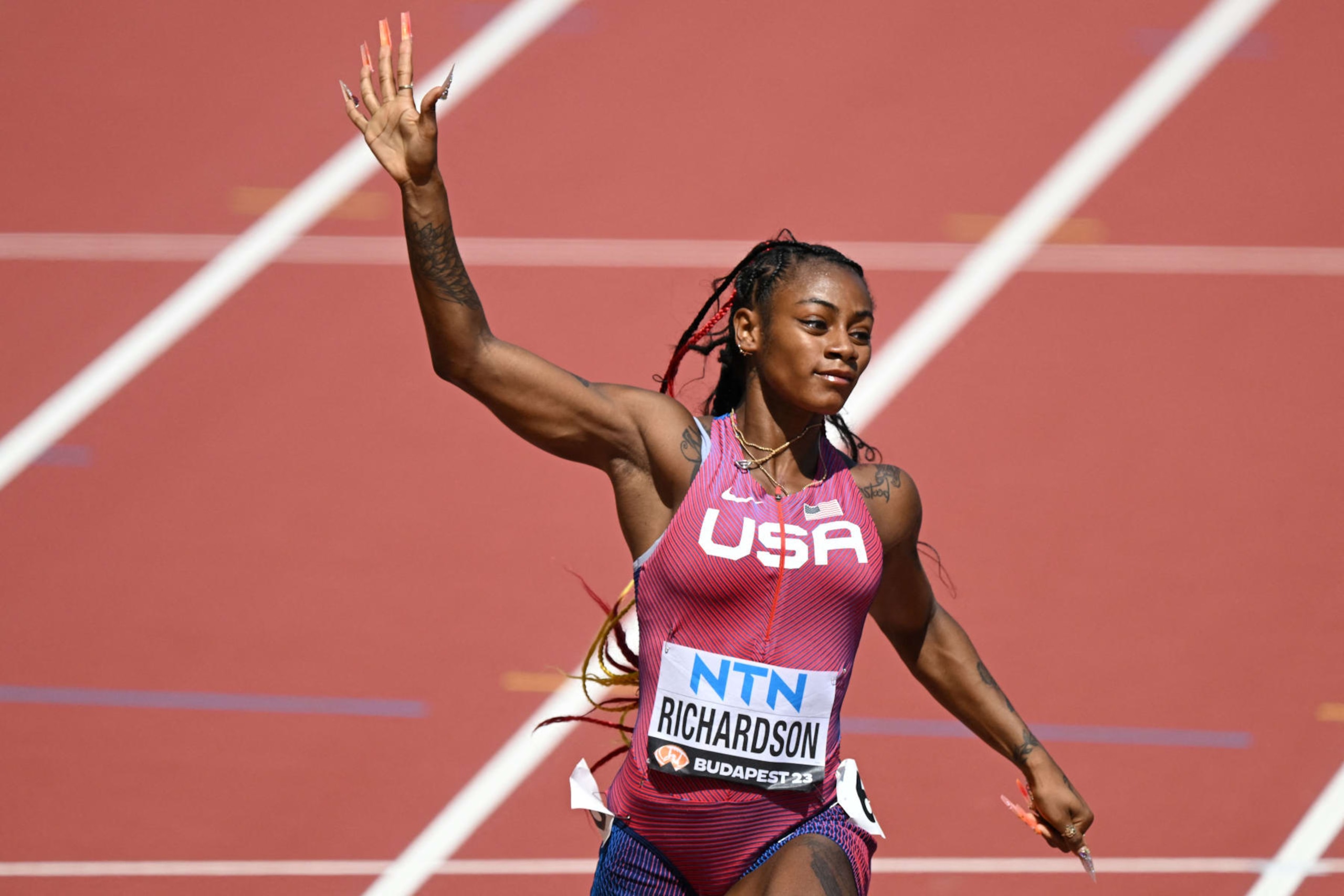 USA's Sha'Carri Richardson reacts after the women's 100m heats during the World Athletics Championships at the National Athletics Centre in Budapest on August 20, 2023. (Photo by Ferenc ISZA / AFP) (Photo by FERENC ISZA/AFP via Getty Images) USA's Sha'Carri Richardson reacts after the women's 100m heats during the World Athletics Championships at the National Athletics Centre in Budapest on August 20, 2023. (Photo by Ferenc ISZA / AFP) (Photo by FERENC ISZA/AFP via Getty Images)